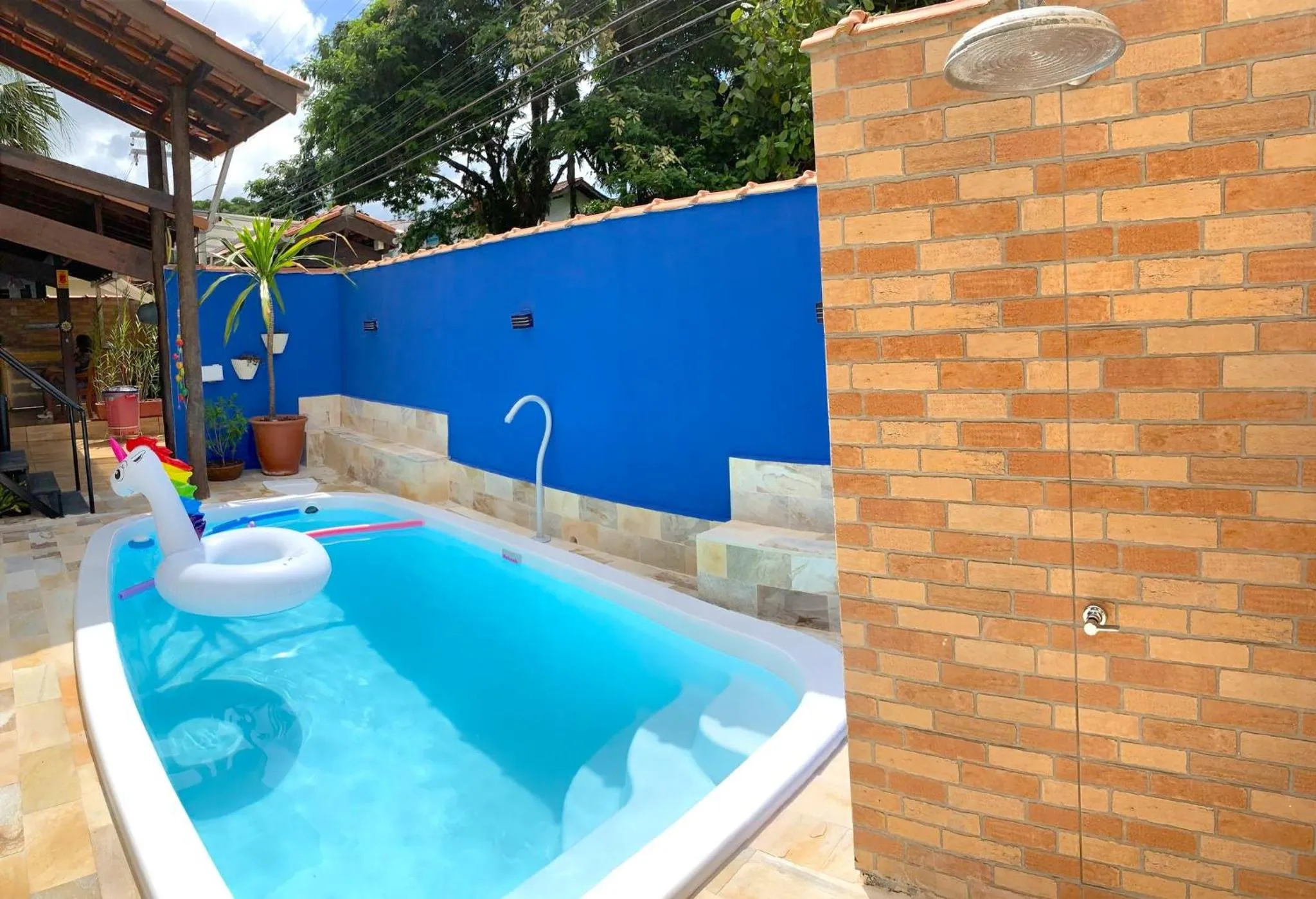 Swimming pool in VELINN Pousada Praia do Perequê