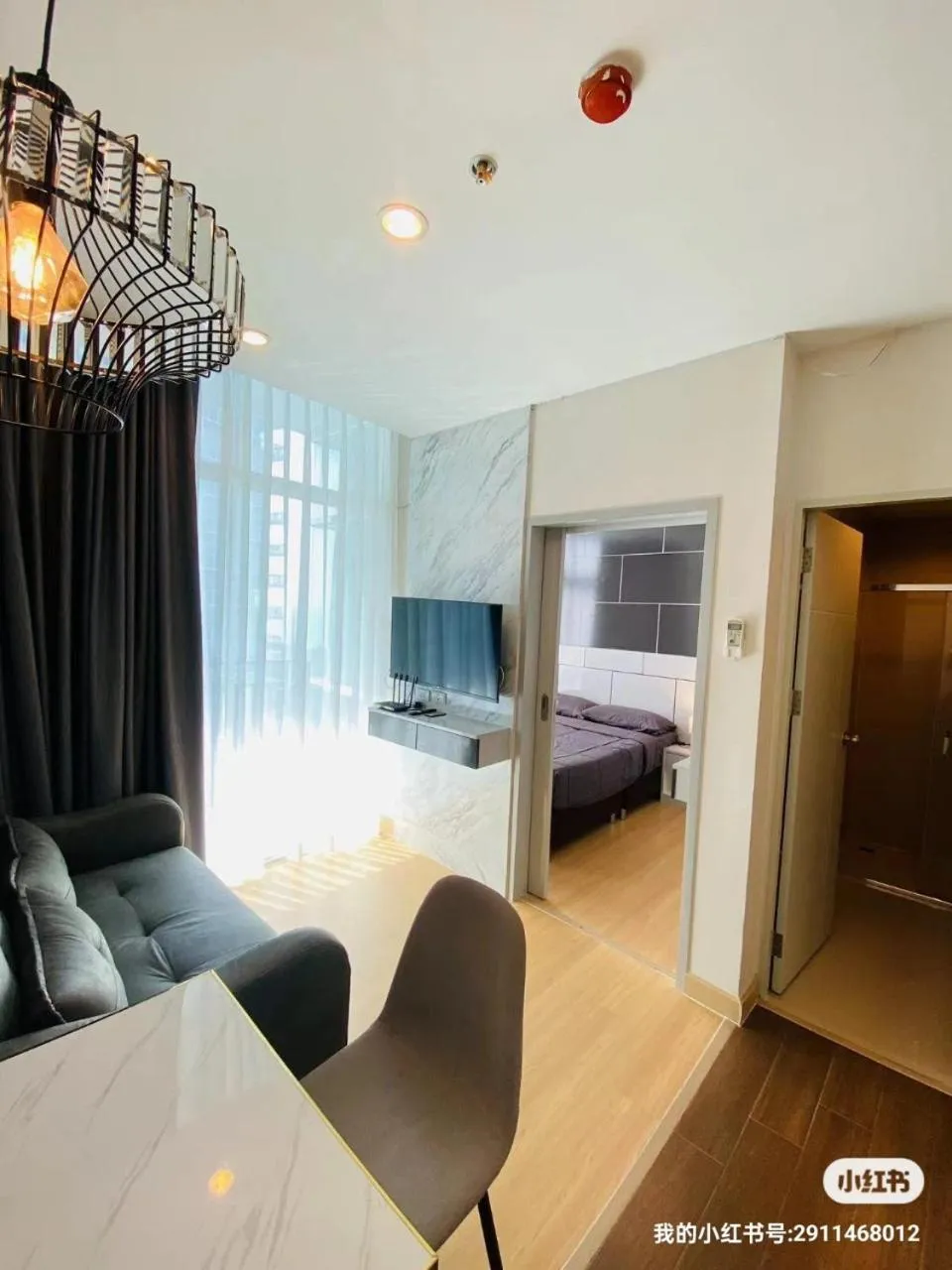 Living room, Bed in The Grand Jomtien Condo