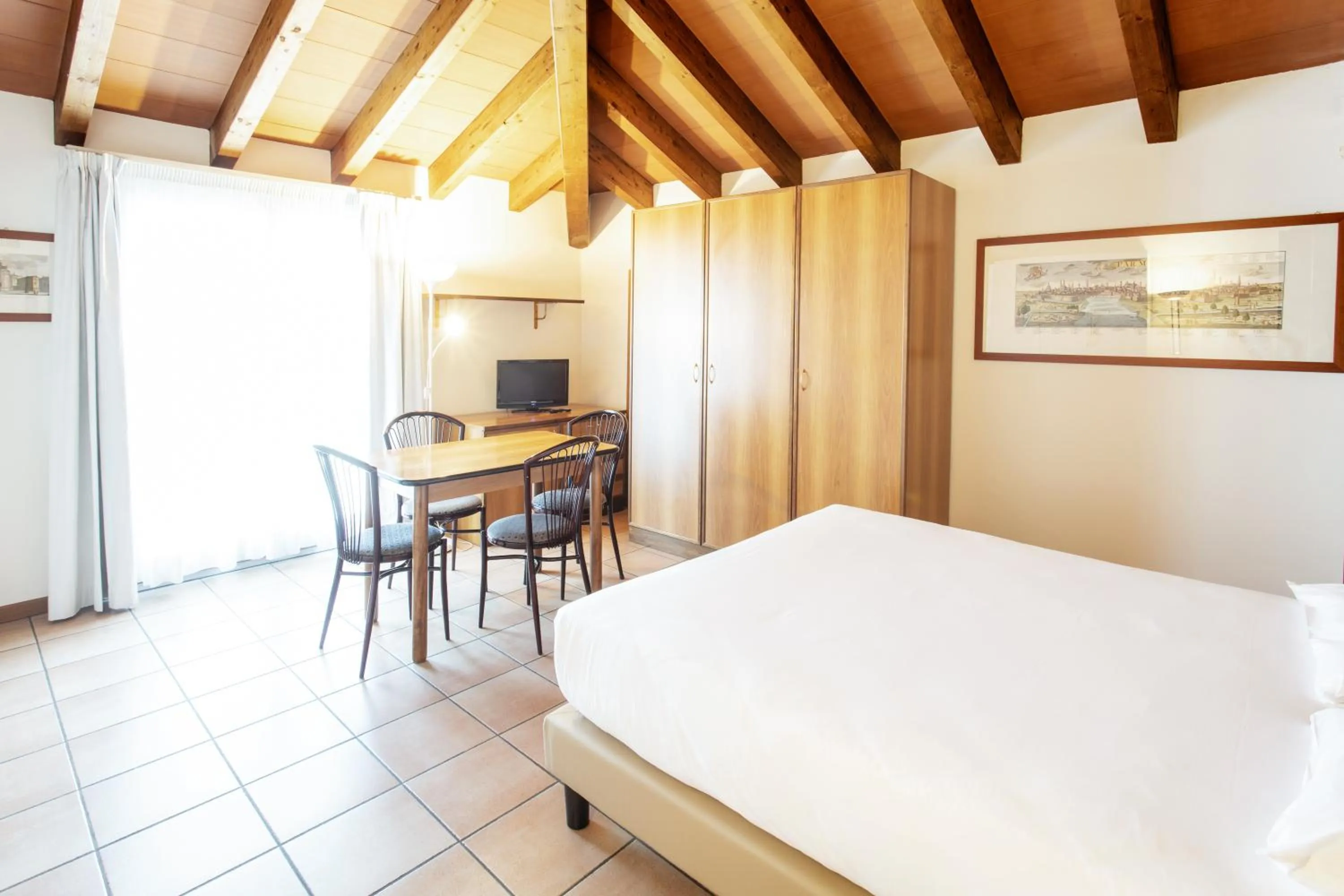 Living room, Bed in Residenza Le Cupole