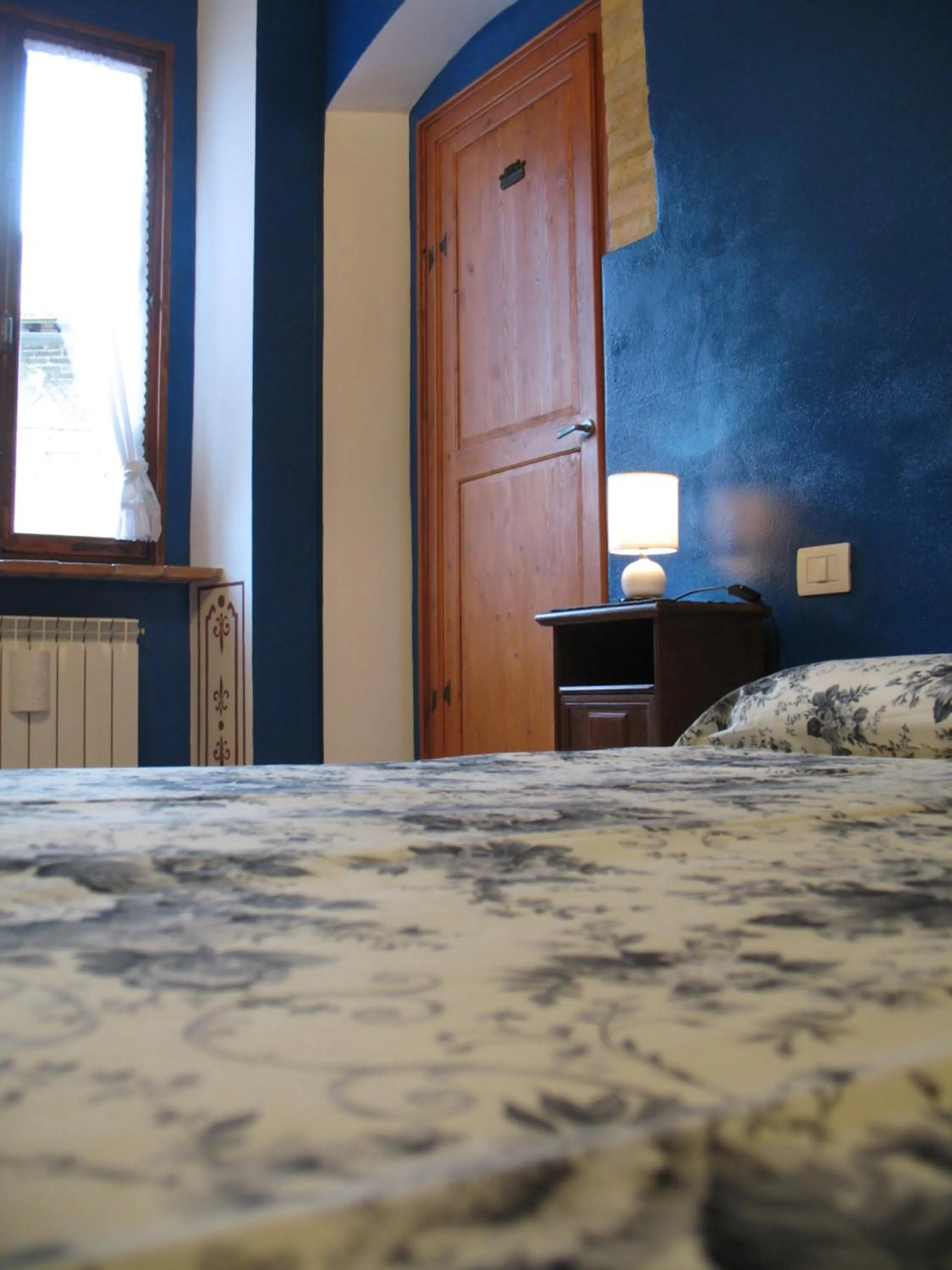 Photo of the whole room in Locazione Turistica Totti