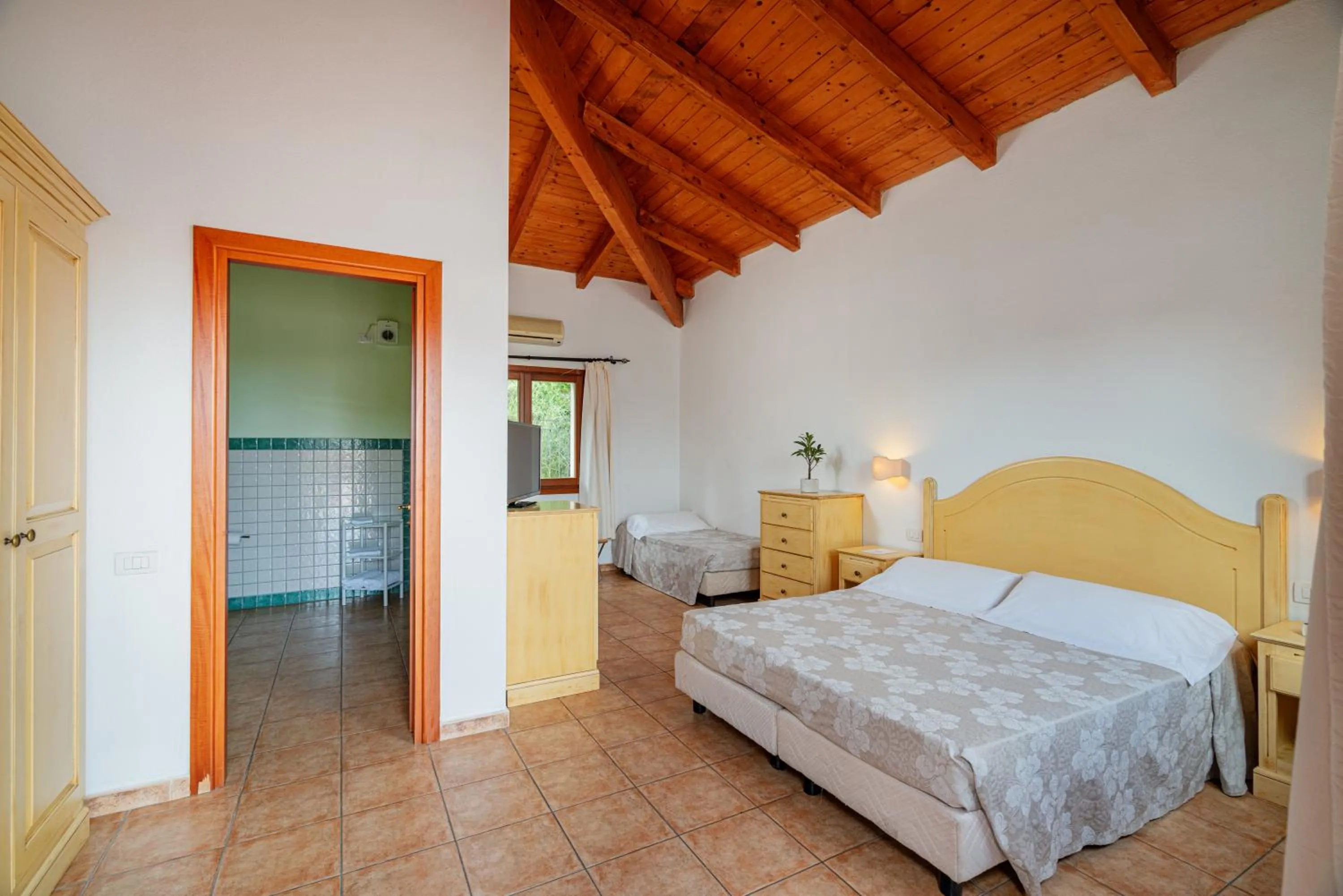 Photo of the whole room, Bed in Club Esse Cala Gonone