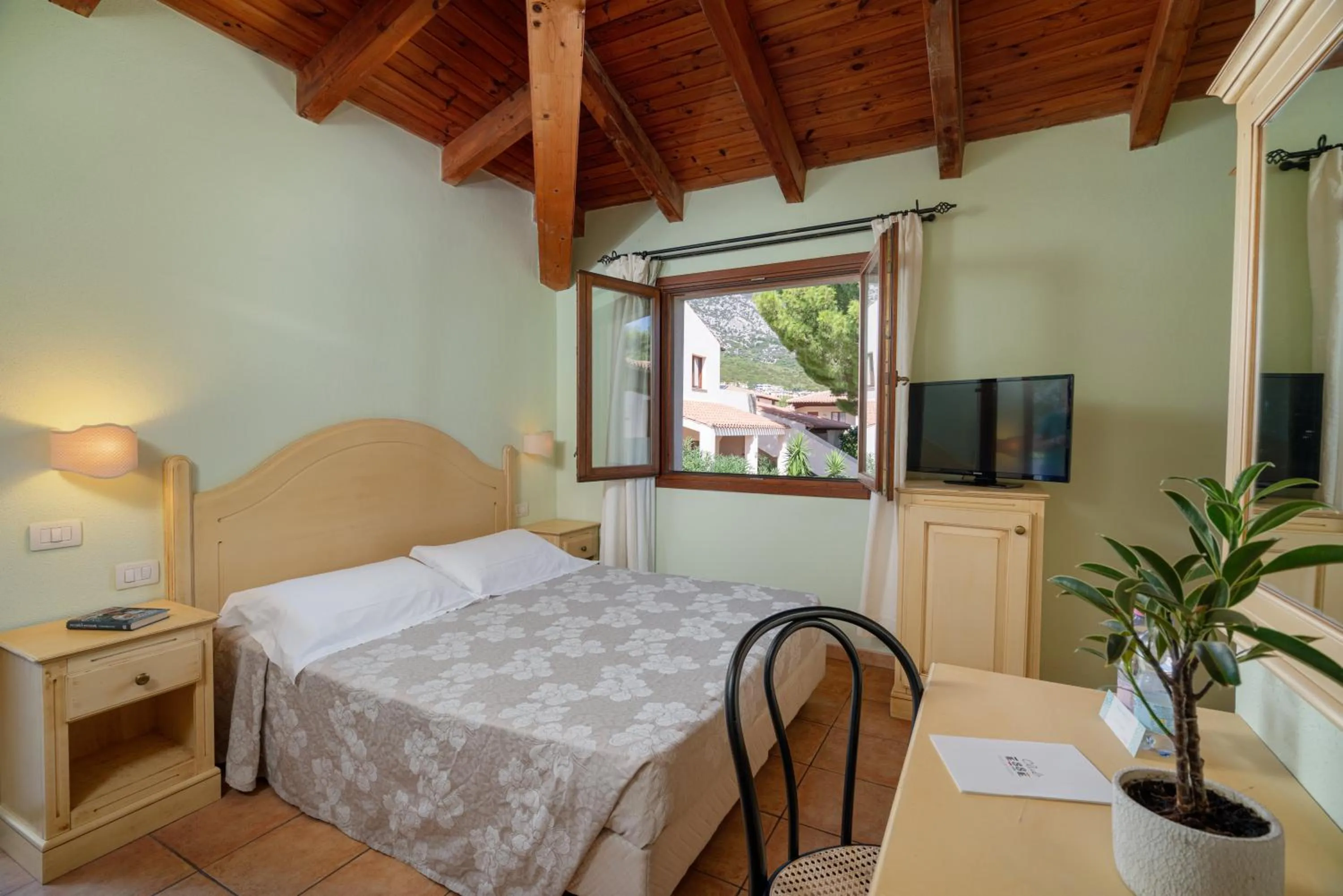 Bedroom, Bed in Club Esse Cala Gonone