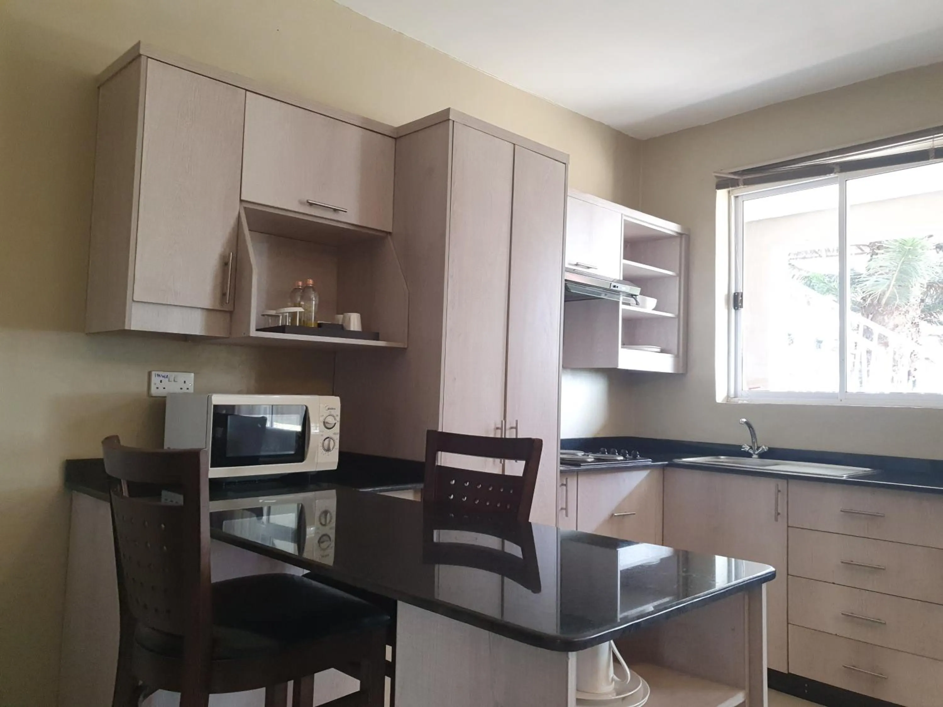 Kitchen or kitchenette in Serendib Suites and Conference Center