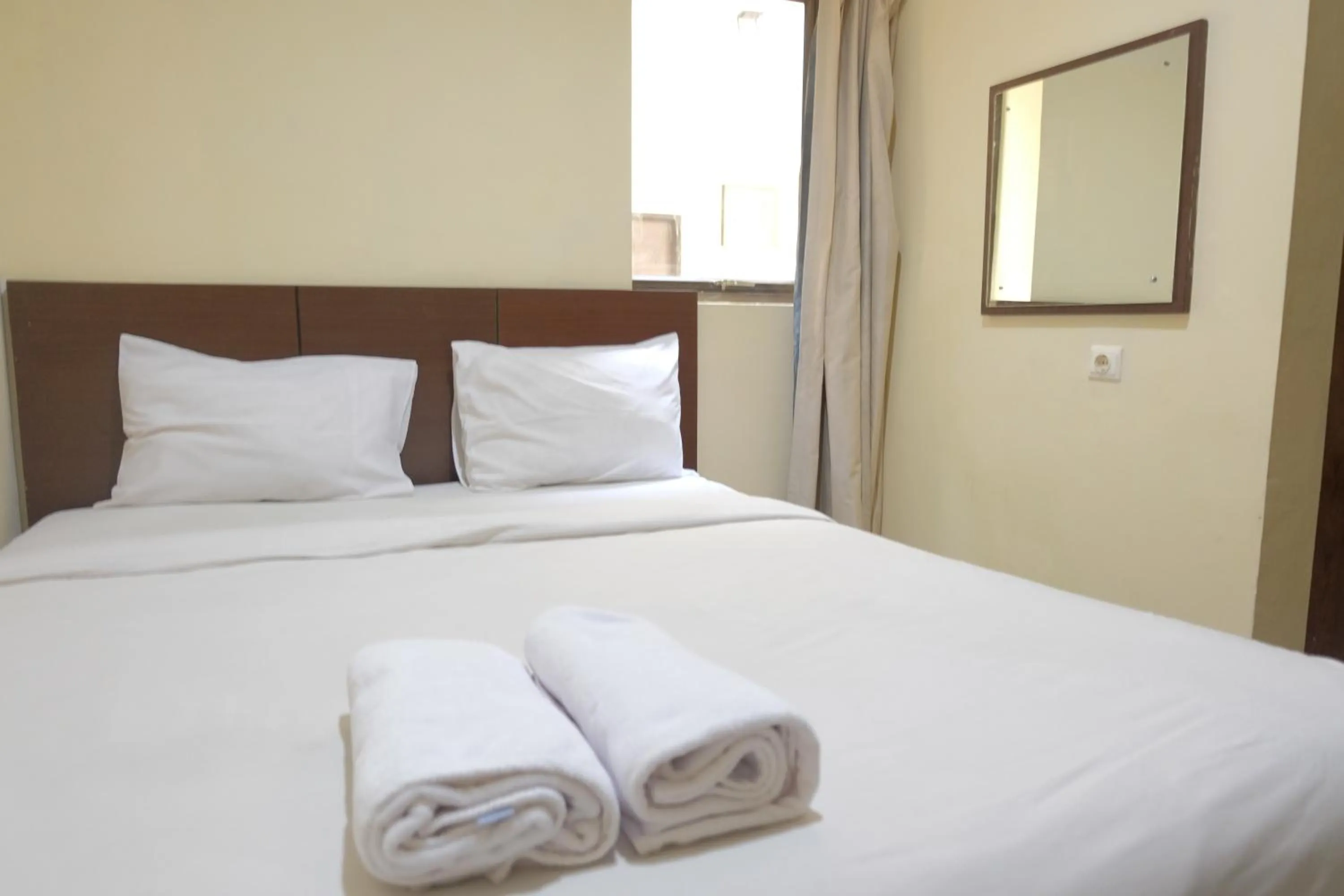 Bed in De Nusantara Hotel Syariah