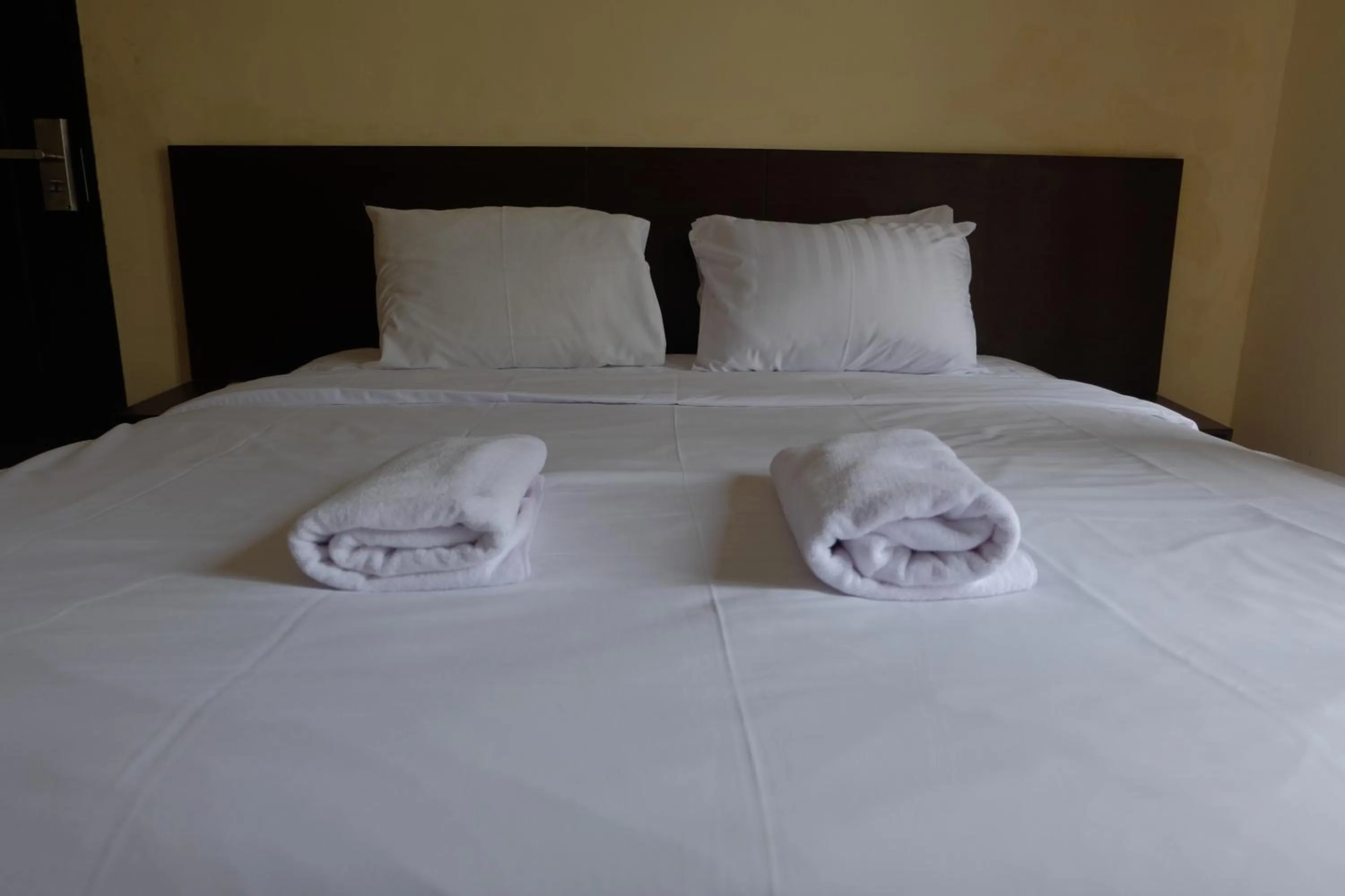 Bed in De Nusantara Hotel Syariah