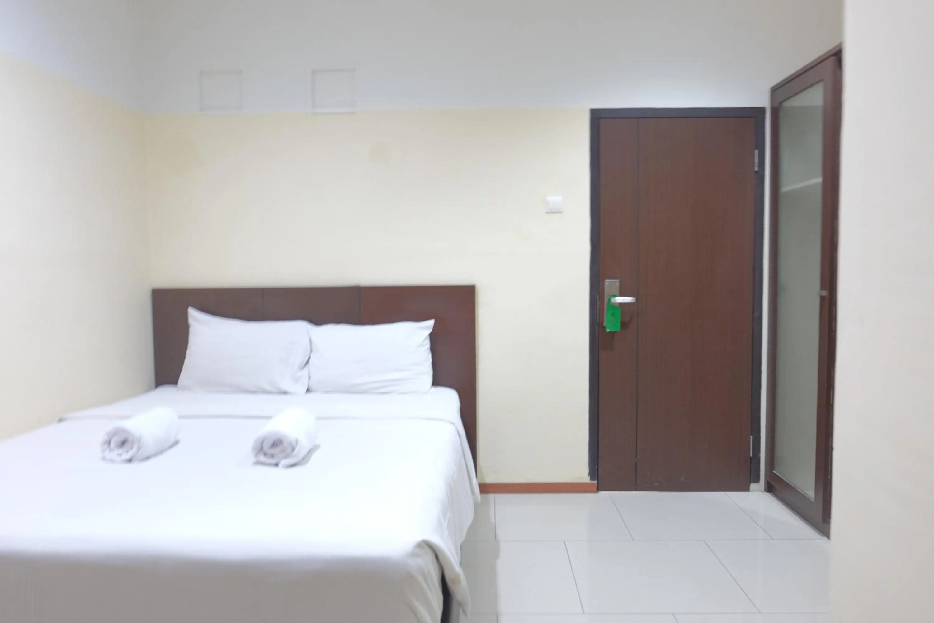 Bed in De Nusantara Hotel Syariah