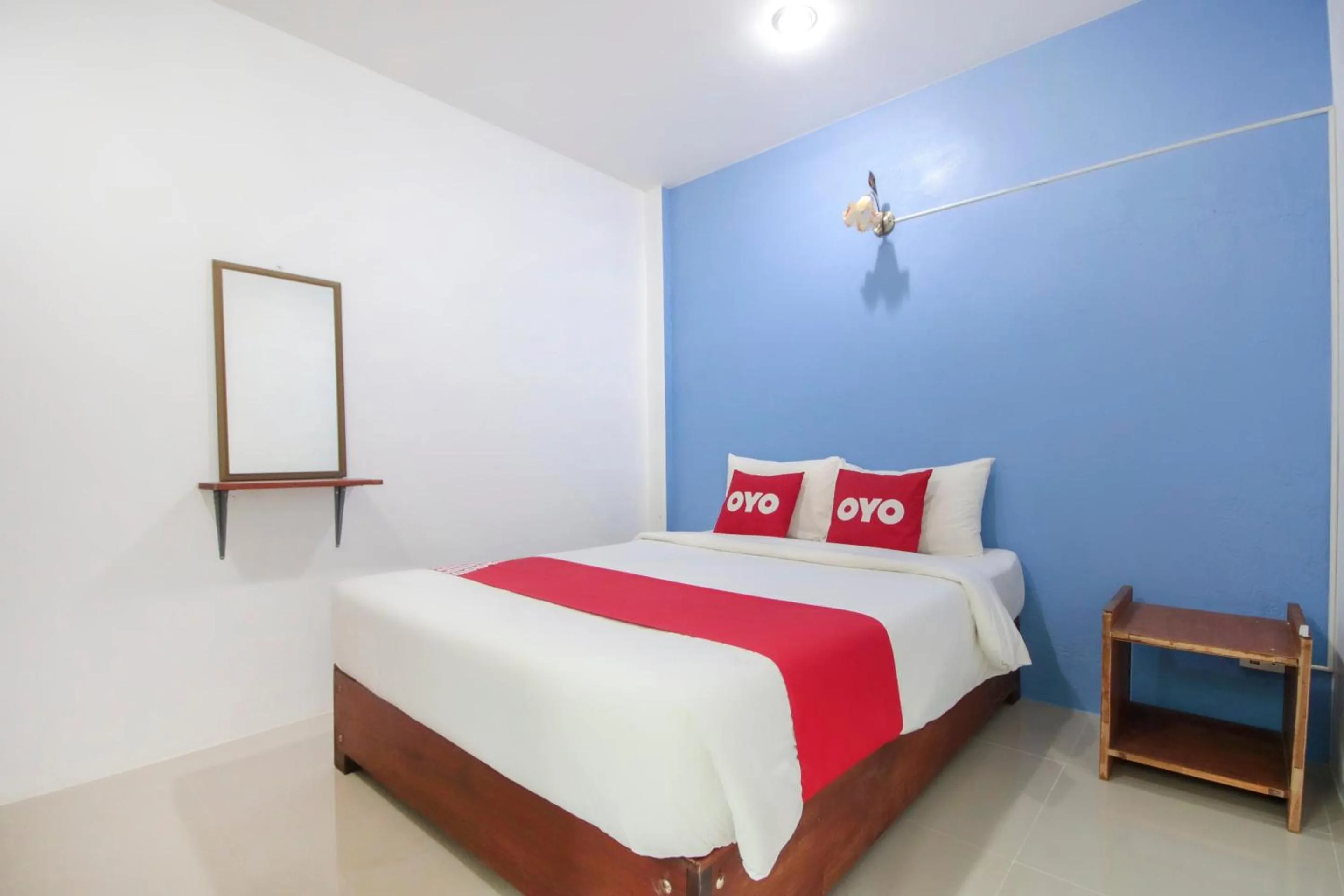 Bedroom in OYO 1120 The Royhanna Beach Home