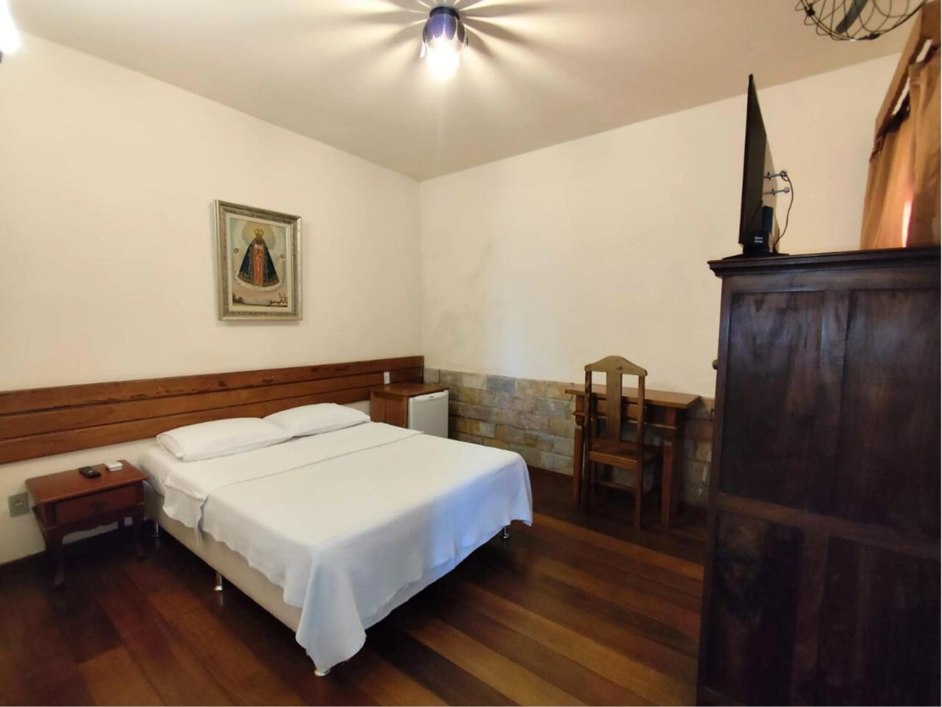 Bed in Pousada Geraes