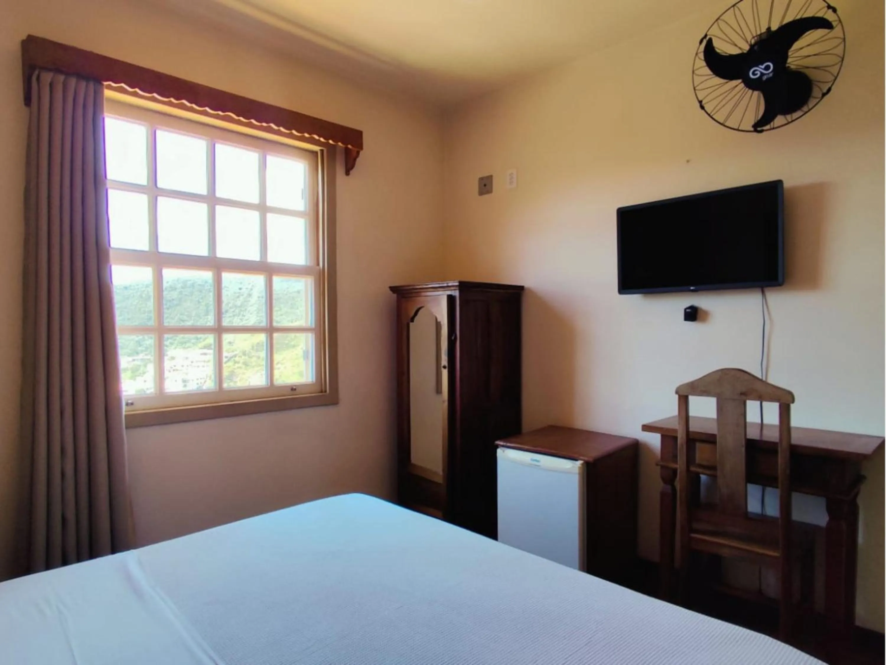 Bed in Pousada Geraes