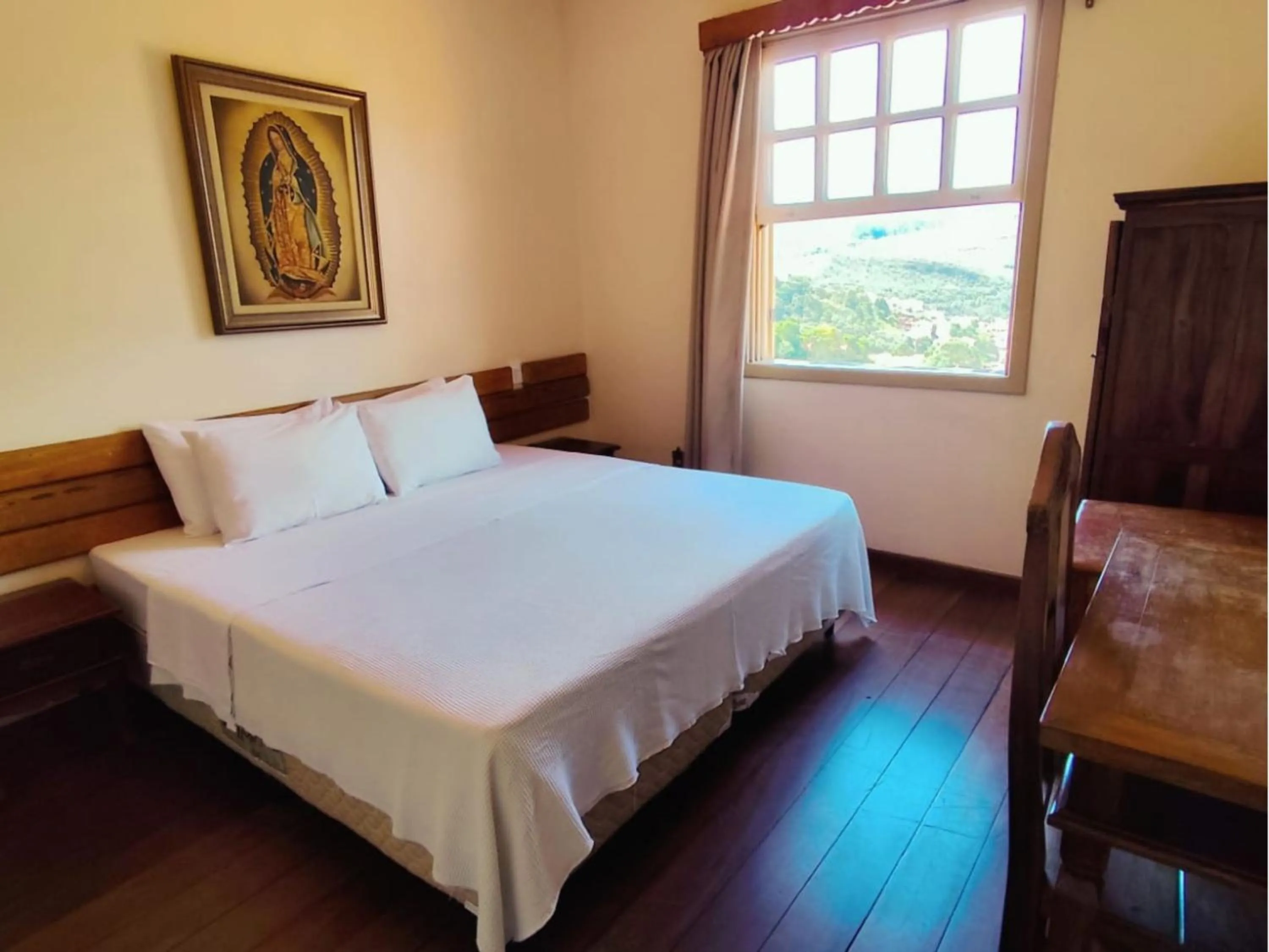 Bed in Pousada Geraes