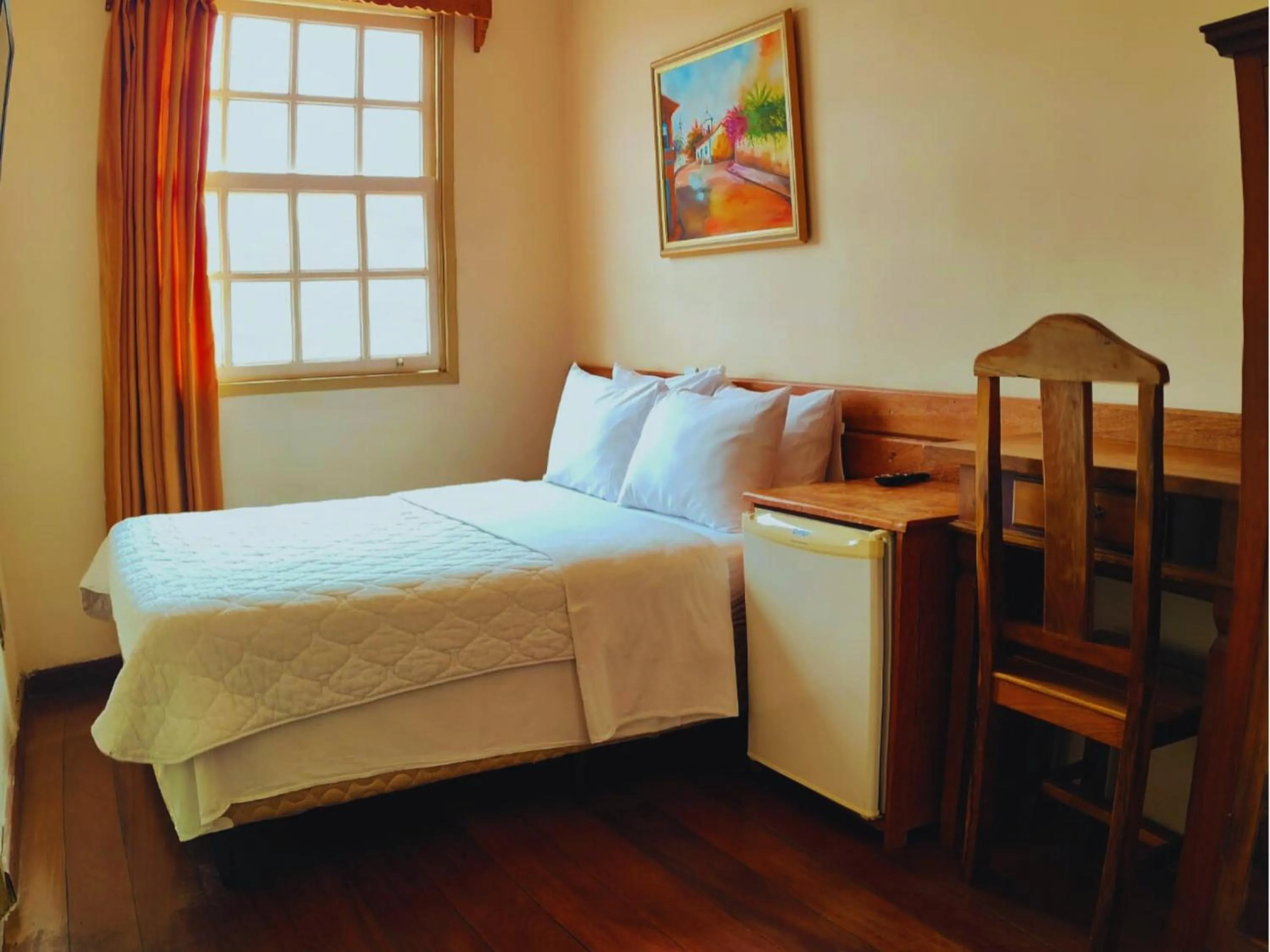 Bed in Pousada Geraes