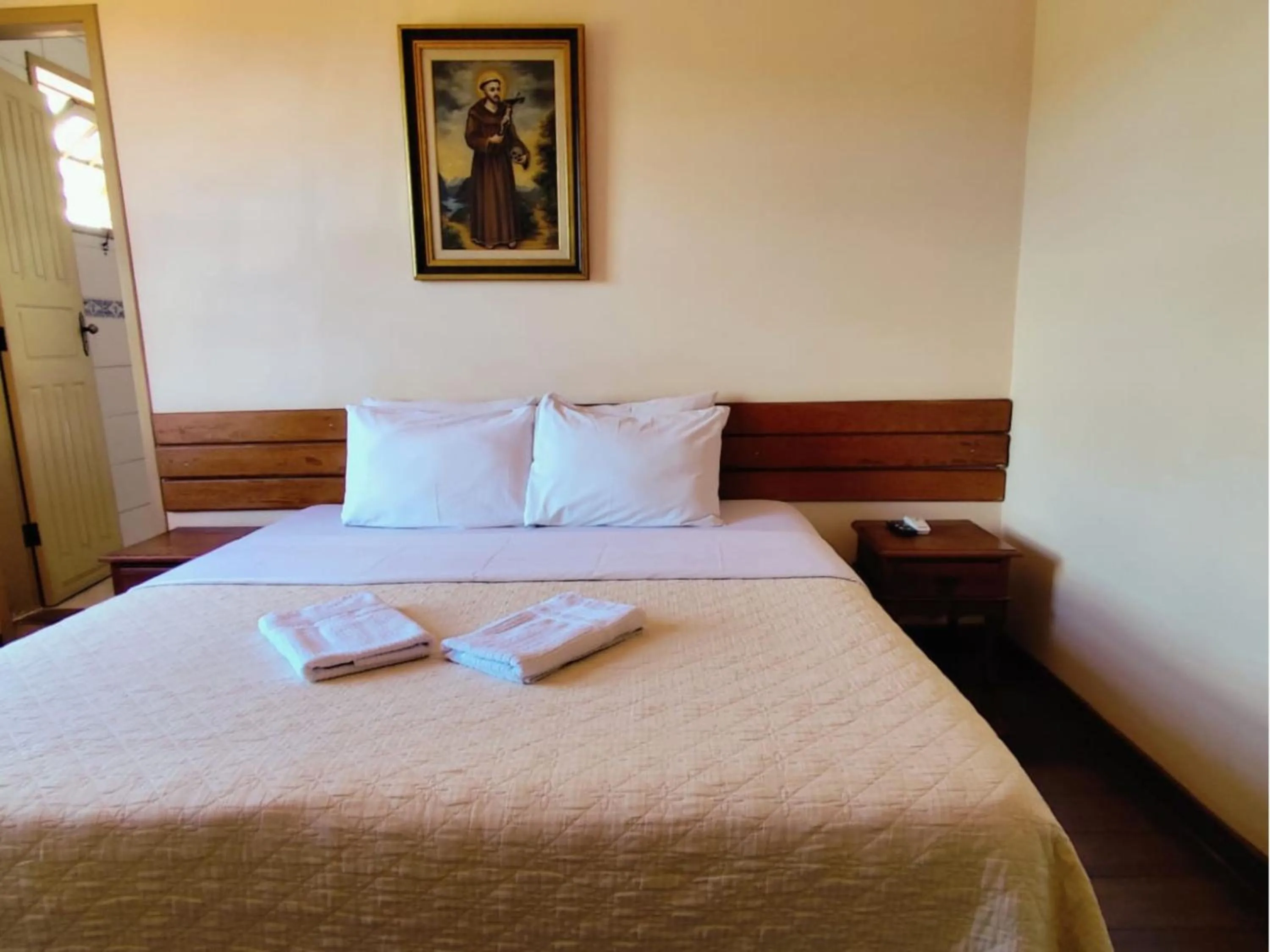 Bed in Pousada Geraes