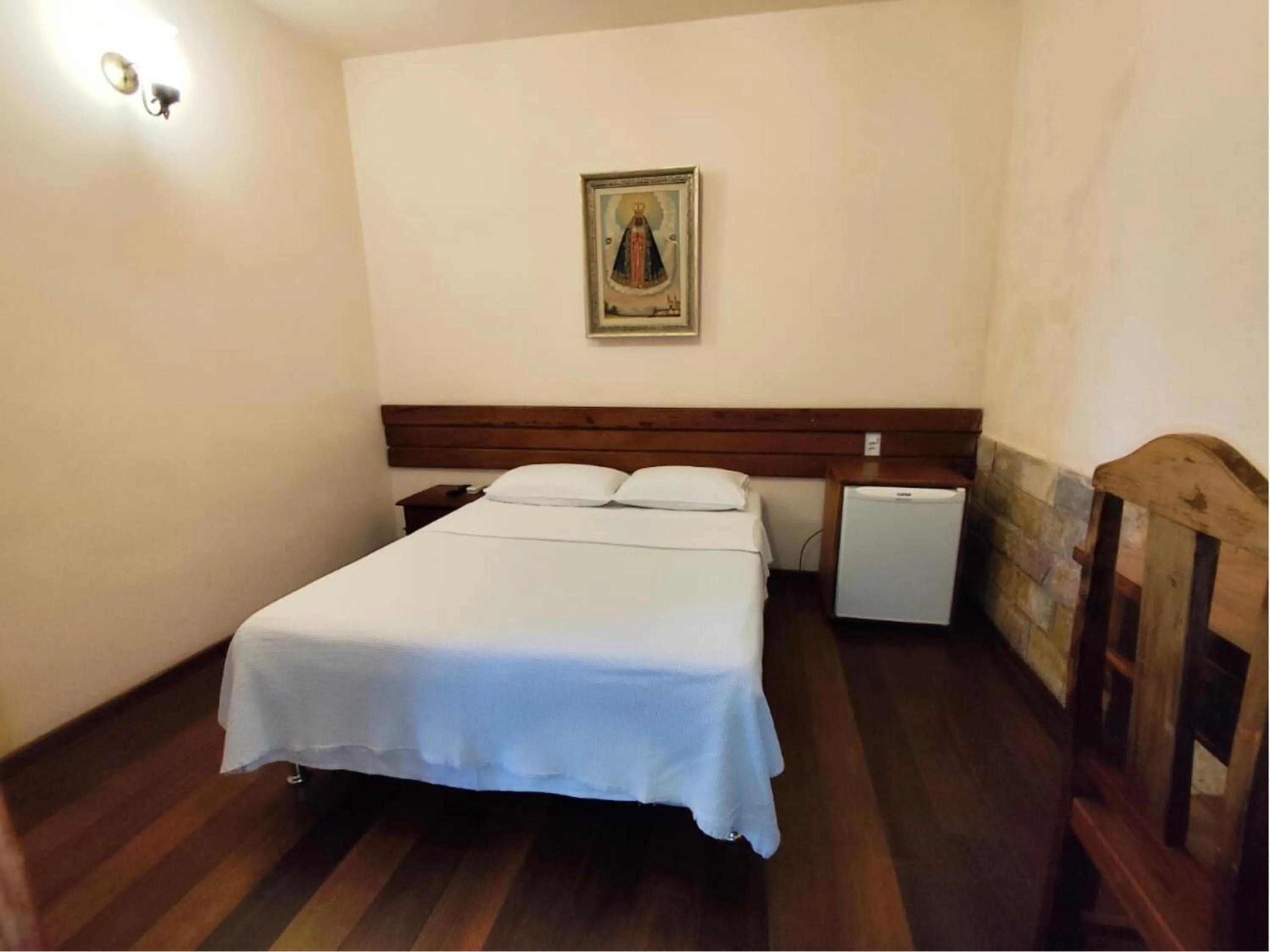 Bed in Pousada Geraes