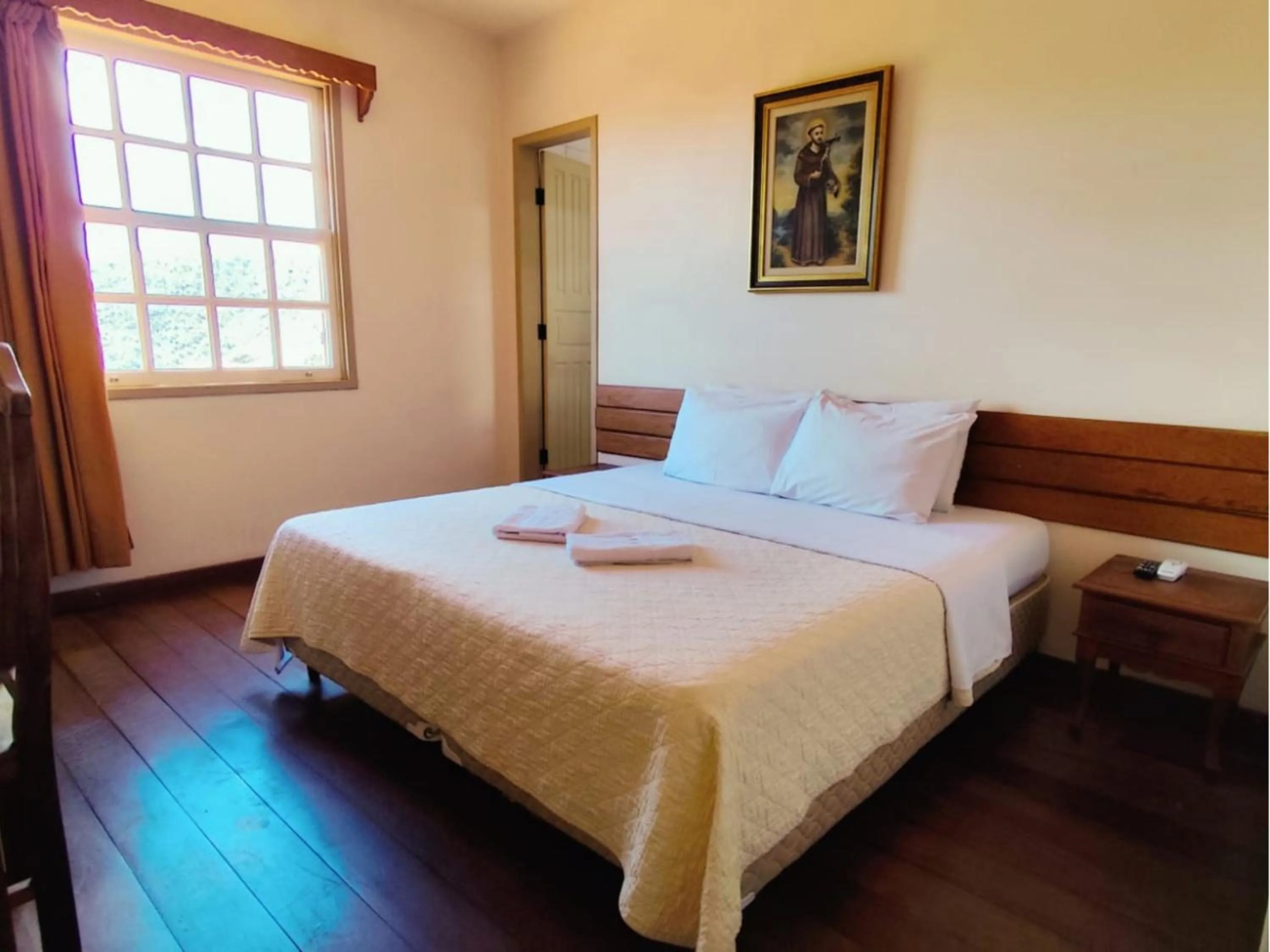 Bed in Pousada Geraes