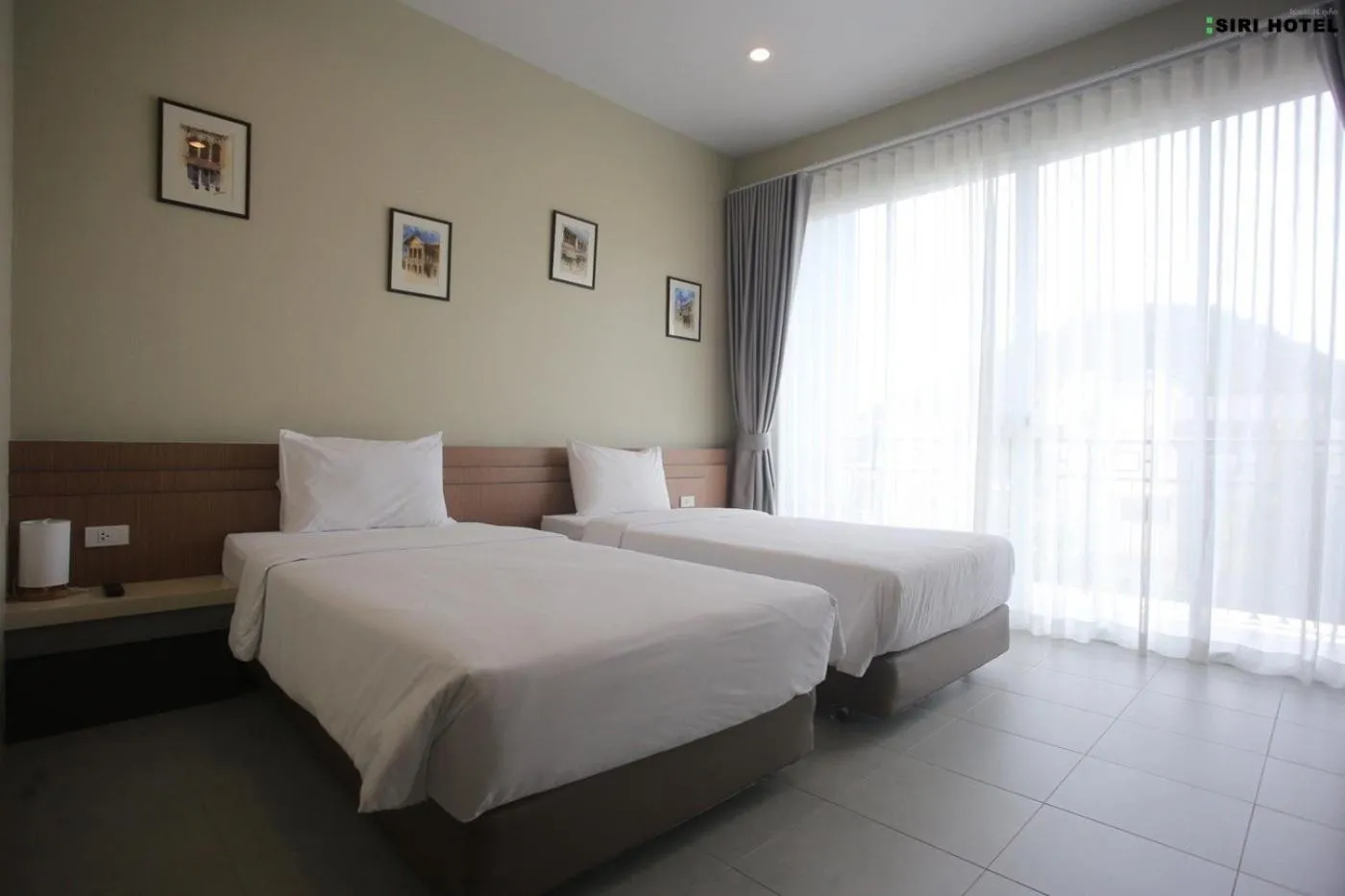 Bed in Siri Hotel Phuket