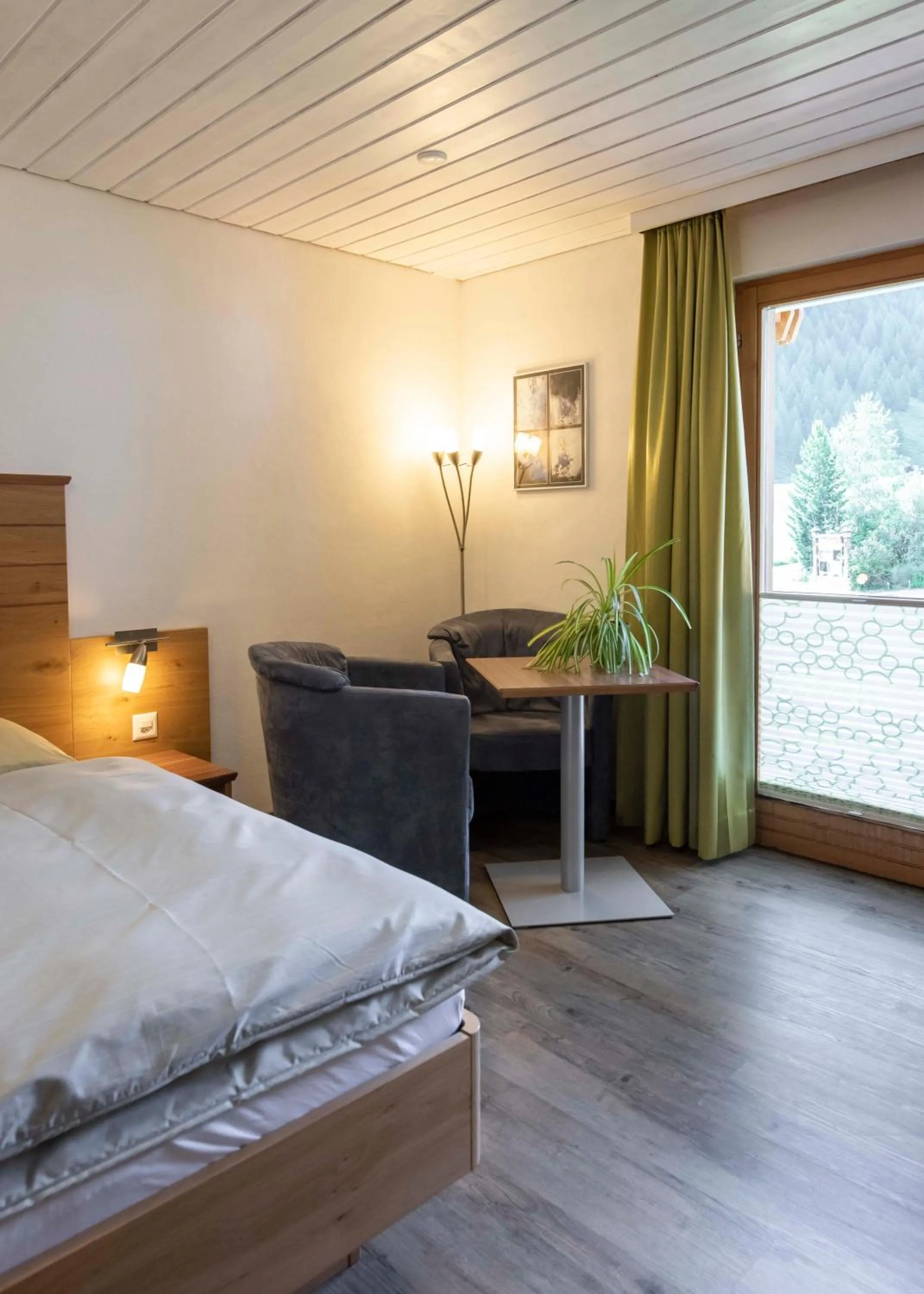 Seating area, Bed in Apartment Madlaina