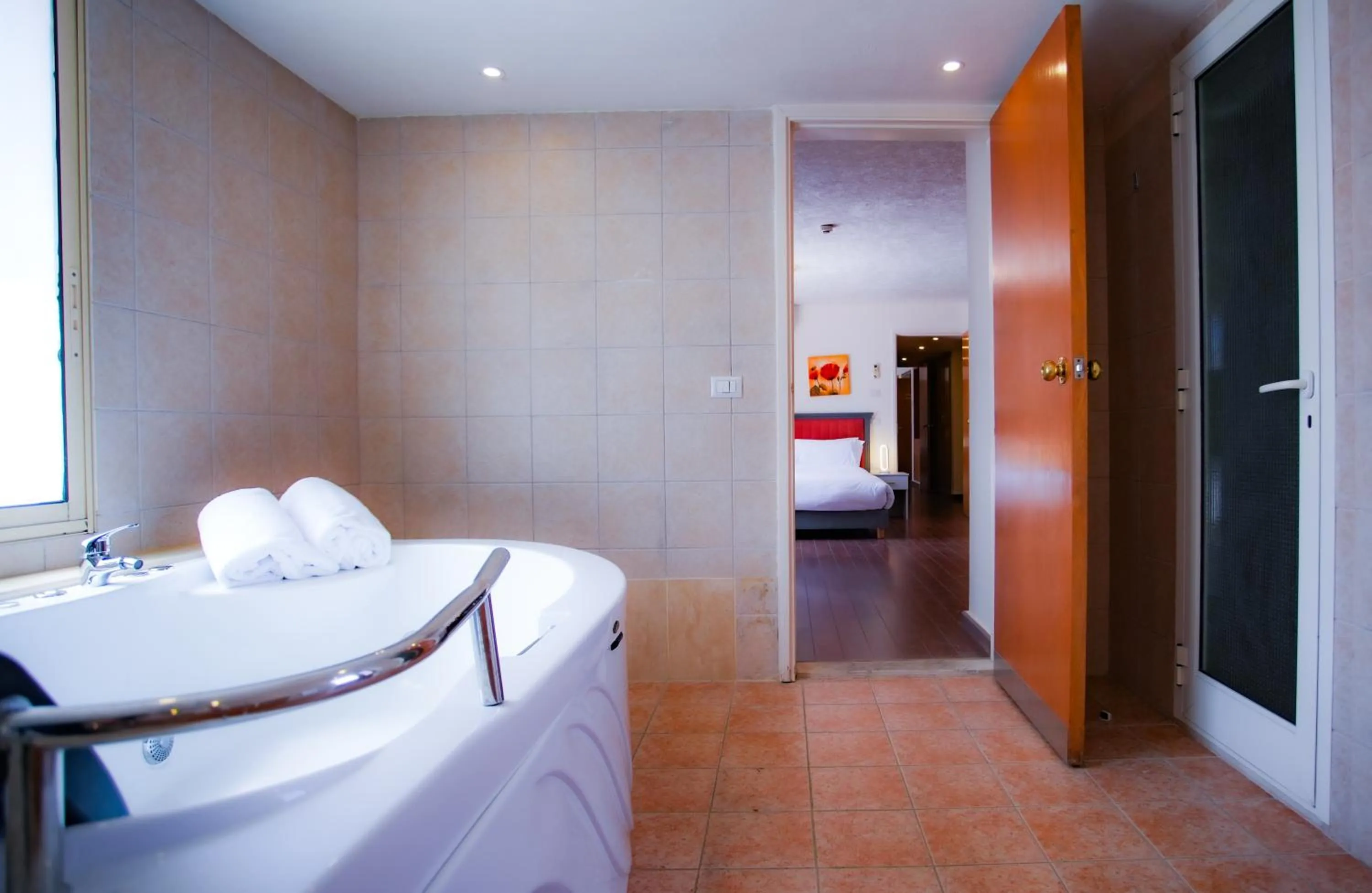 Toilet, Bed in Manara Riva Suites