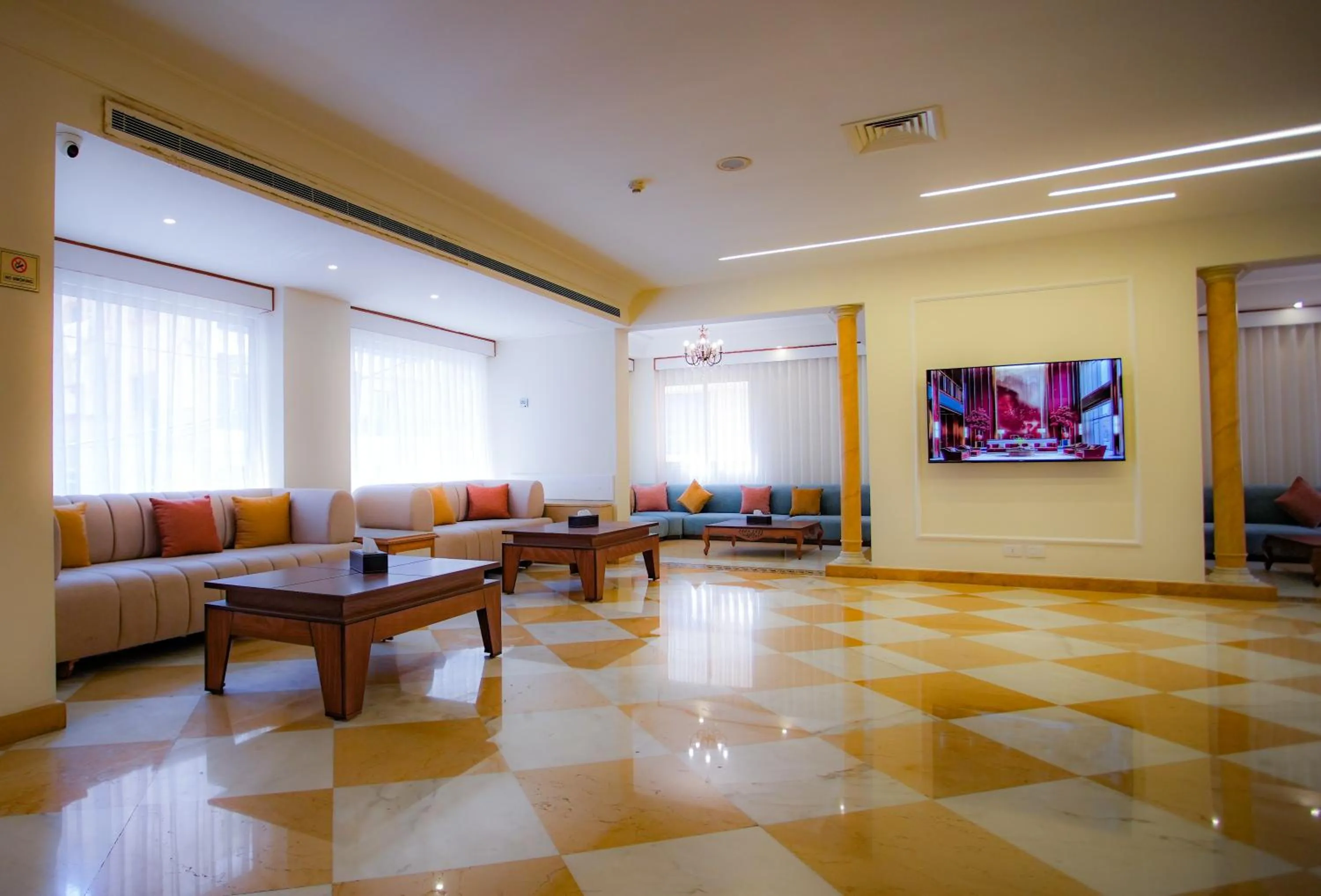 Communal lounge/ TV room in Manara Riva Suites