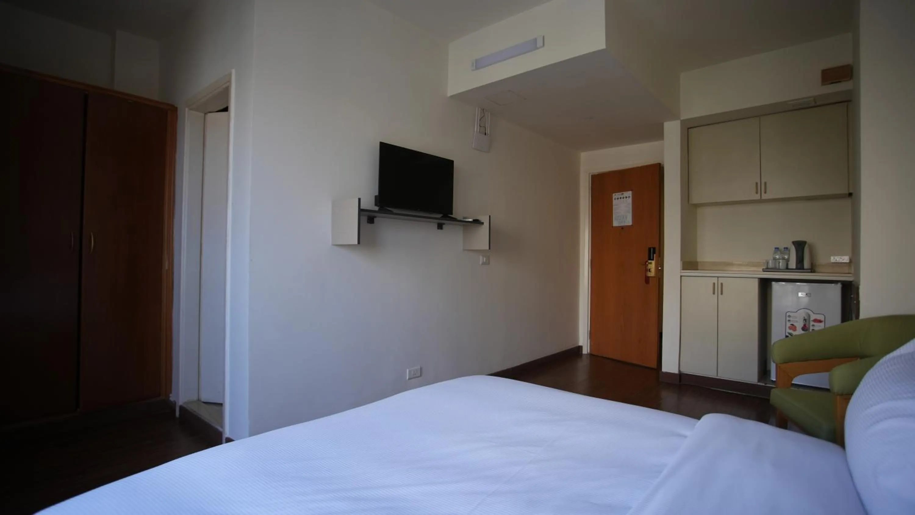 TV and multimedia, Bed in Manara Riva Suites