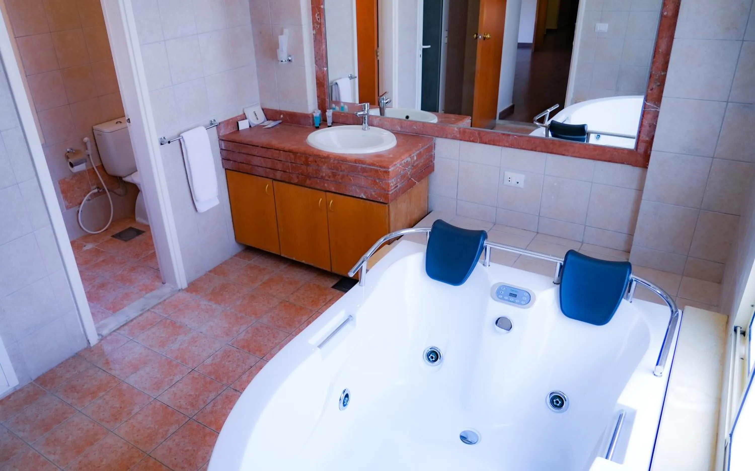 Toilet, Bed in Manara Riva Suites
