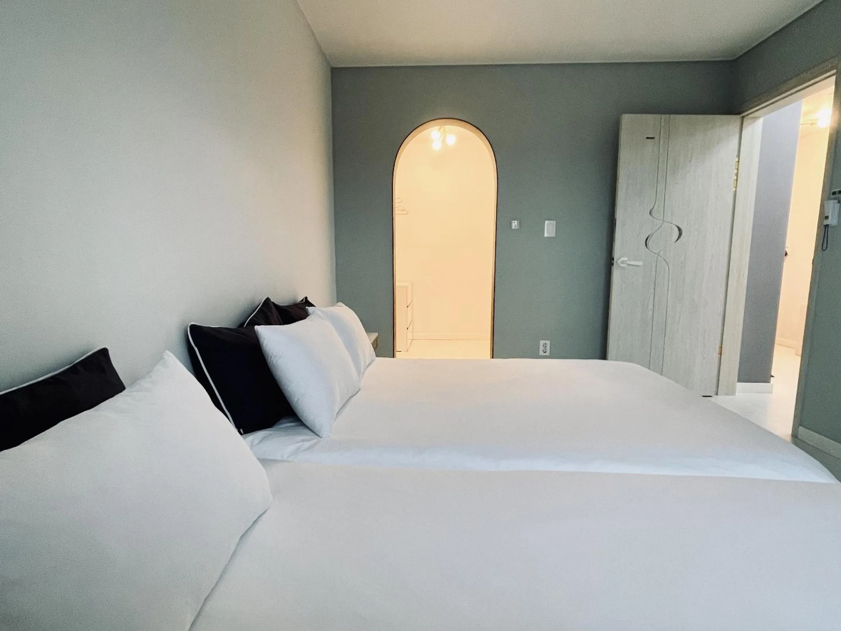 Bed in Jeju Private Poolvilla Gwakjidaon Stay