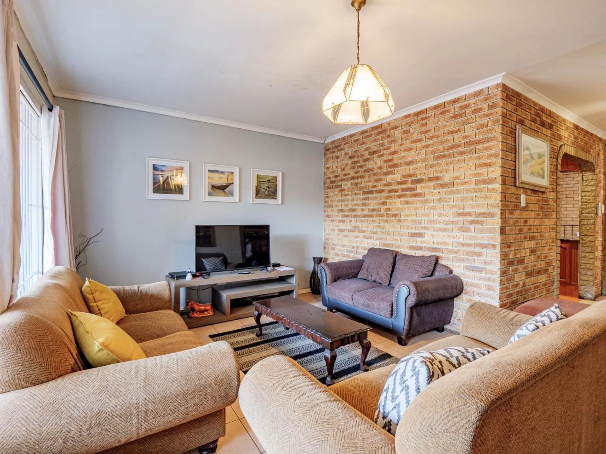 Communal lounge/ TV room in Carrington Guest House