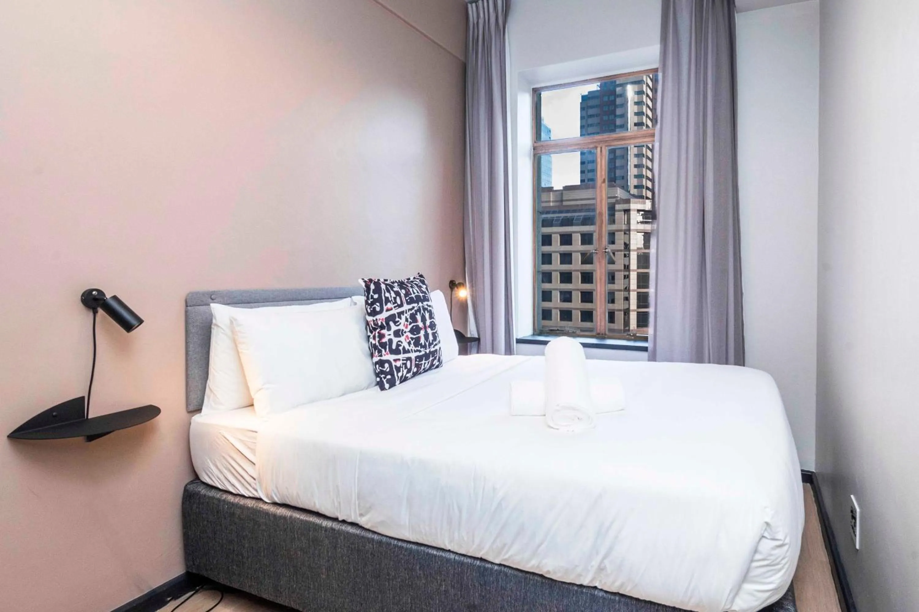 Bed in HAVN Aparthotel by Totalstay