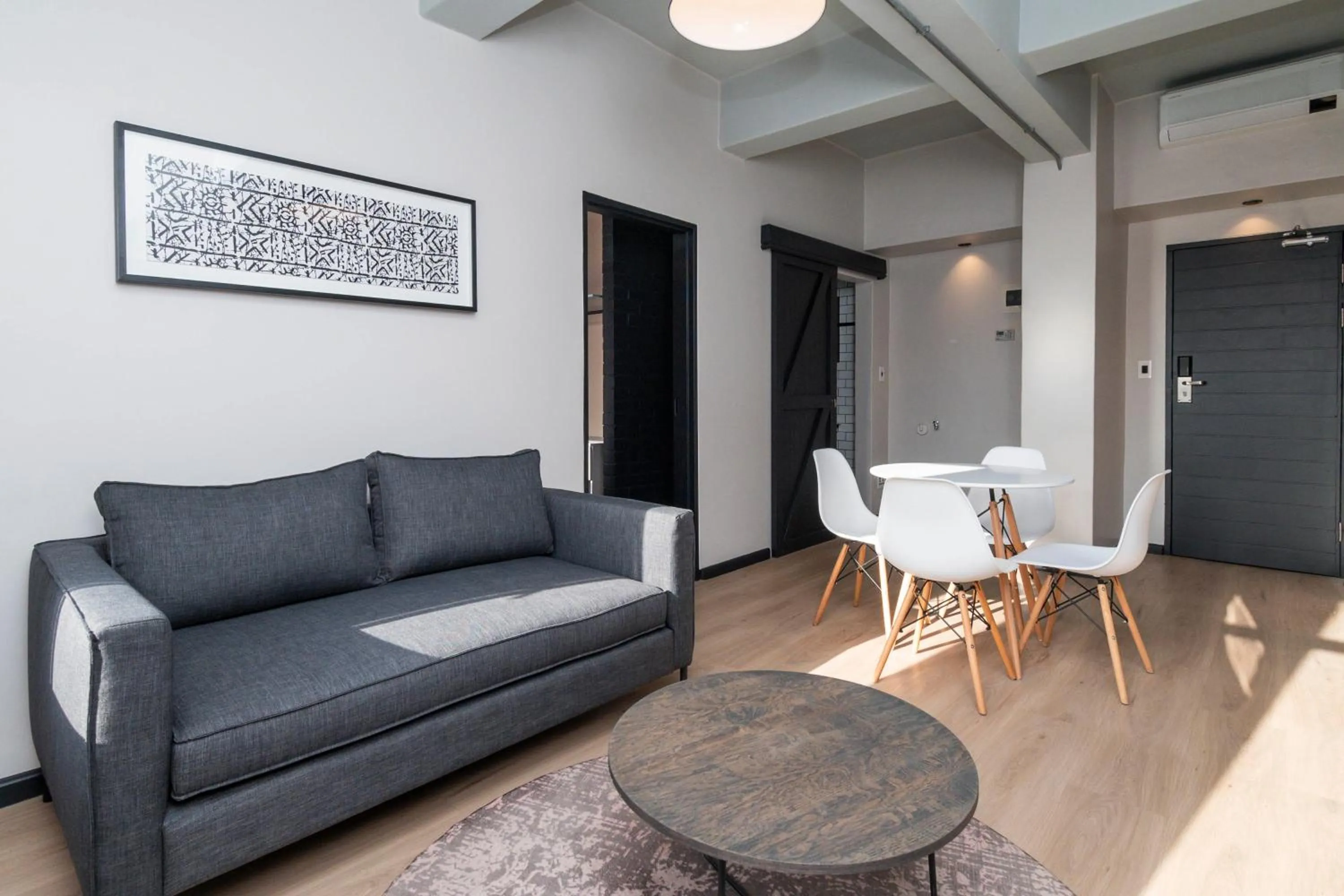 Seating area in HAVN Aparthotel by Totalstay