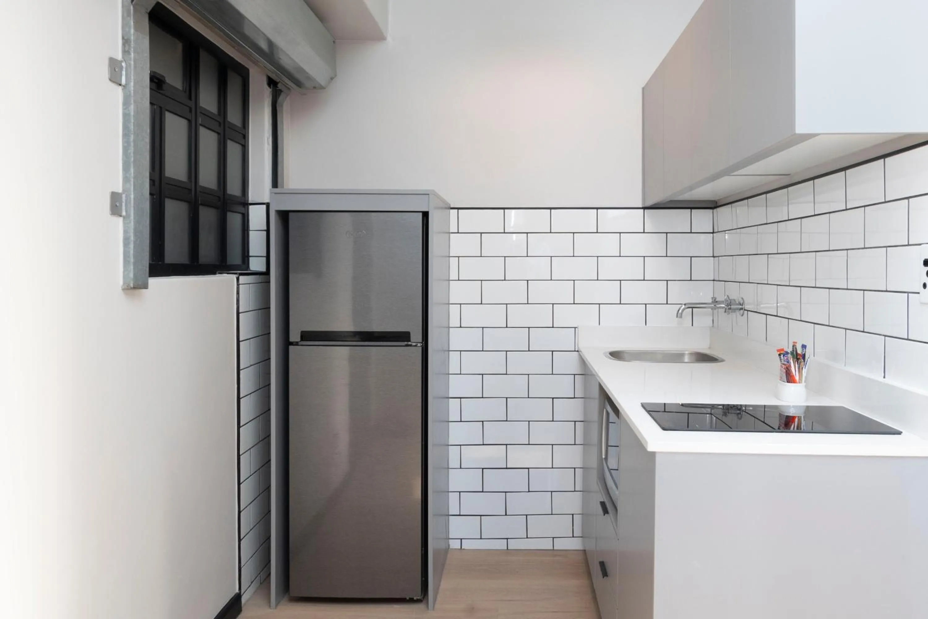 Kitchen or kitchenette in HAVN Aparthotel by Totalstay