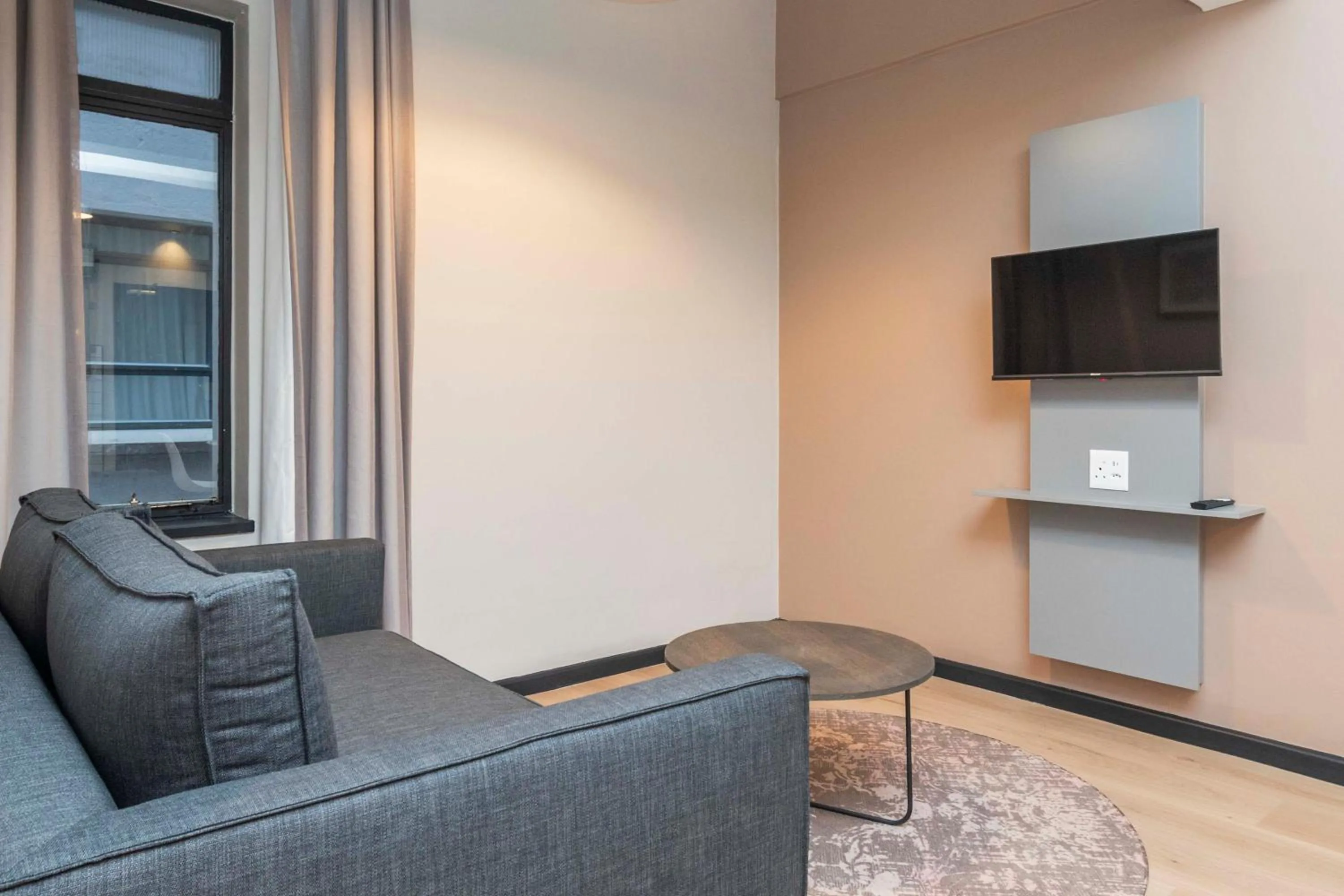 Seating area in HAVN Aparthotel by Totalstay