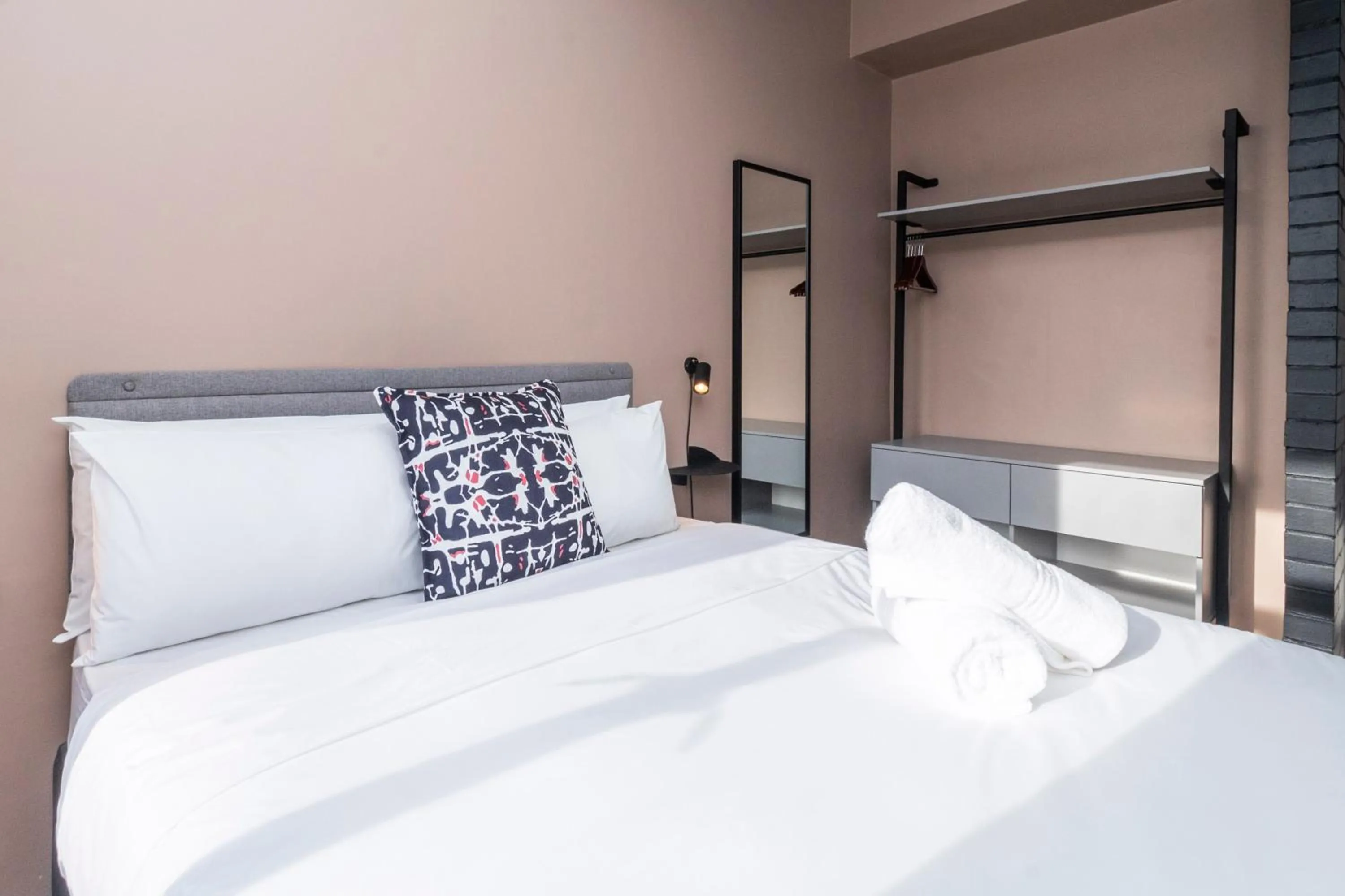 Bed in HAVN Aparthotel by Totalstay