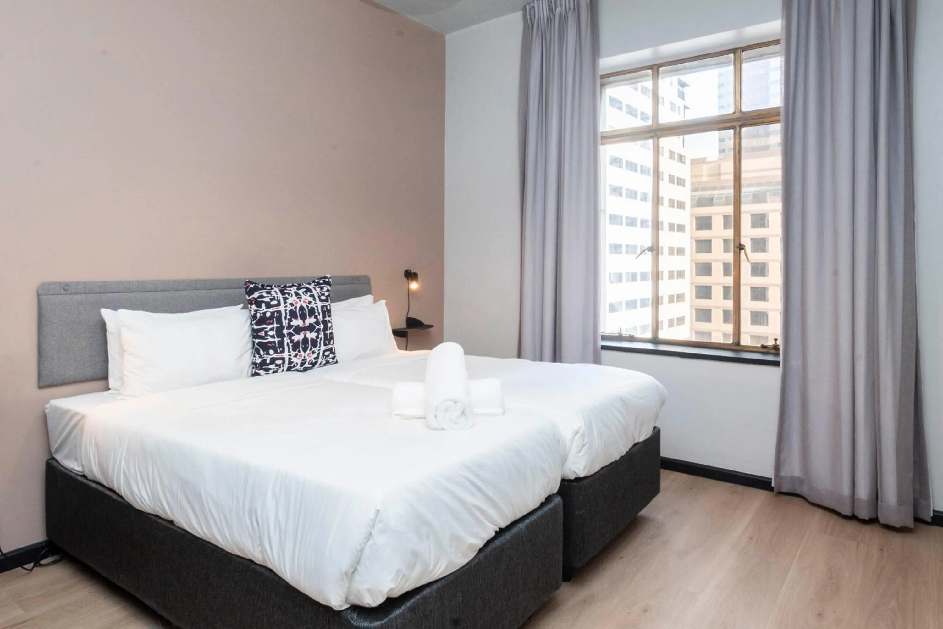 Bed in HAVN Aparthotel by Totalstay