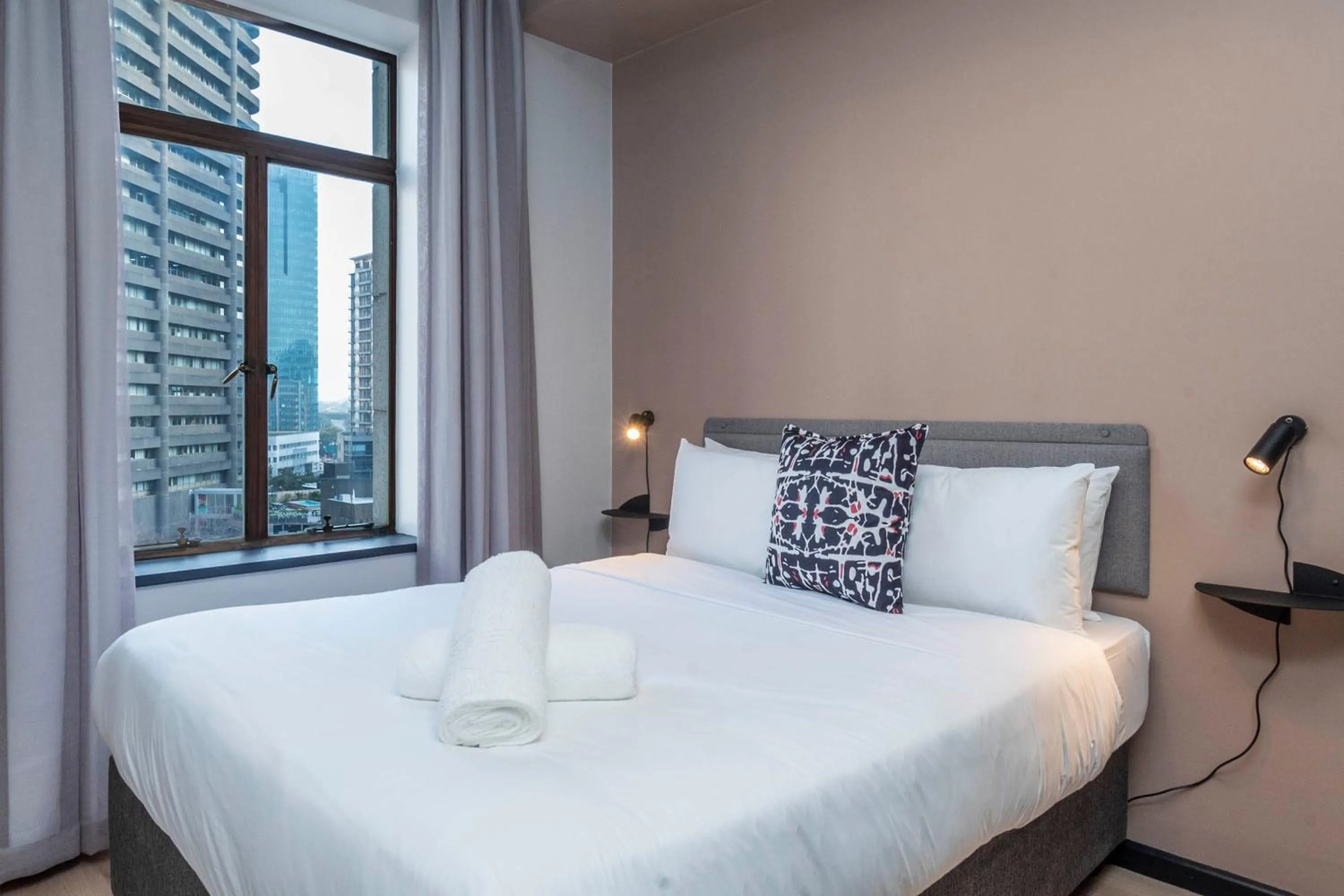 Bed in HAVN Aparthotel by Totalstay