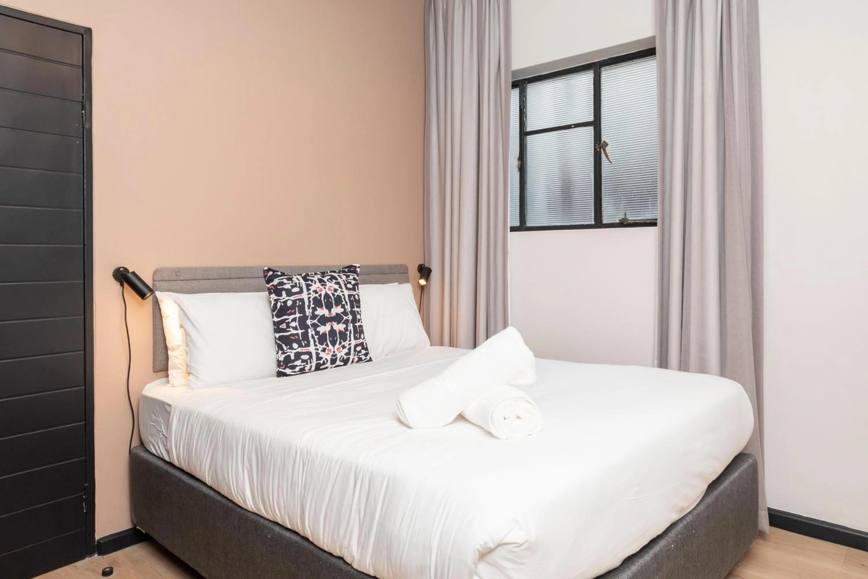 Bed in HAVN Aparthotel by Totalstay