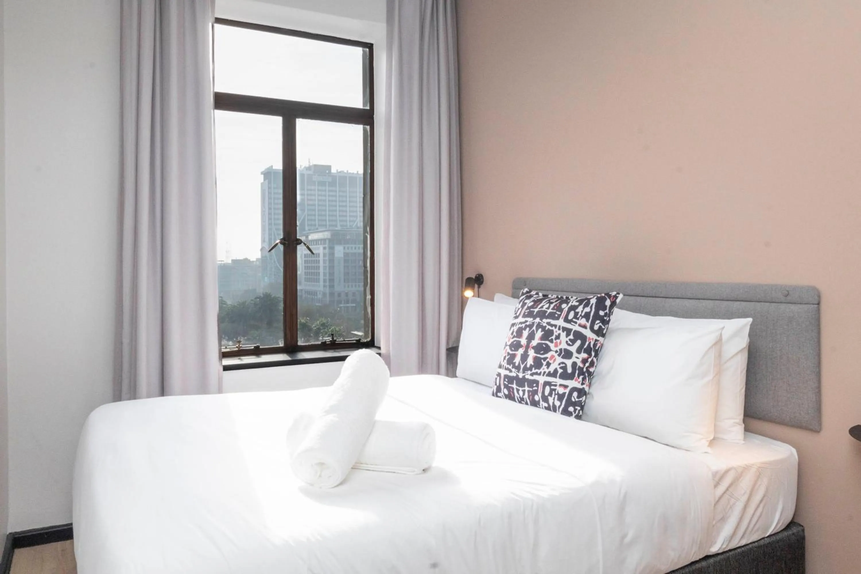 Bed in HAVN Aparthotel by Totalstay