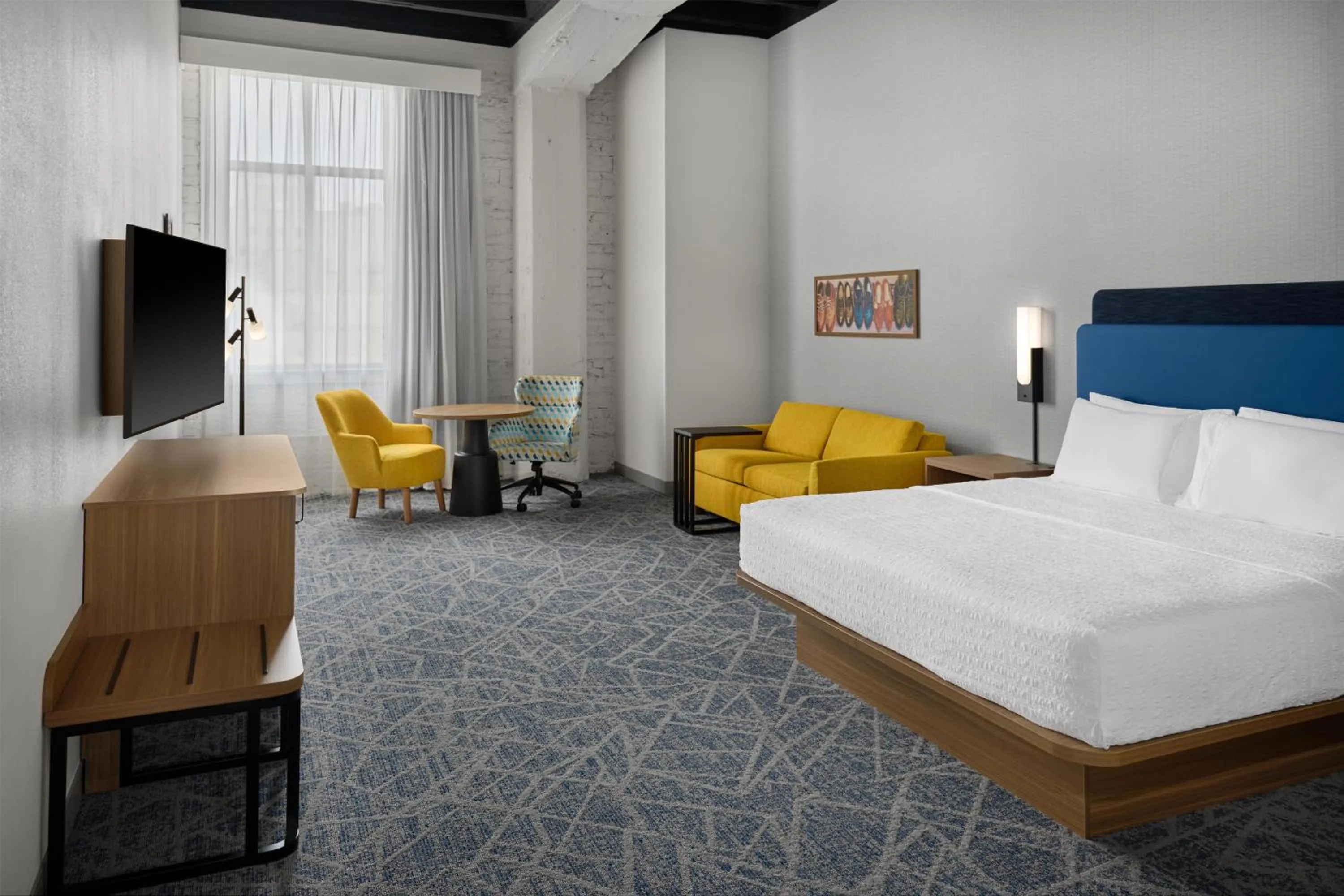 Living room, Bed in Hampton Inn by Hilton Lincoln Downtown