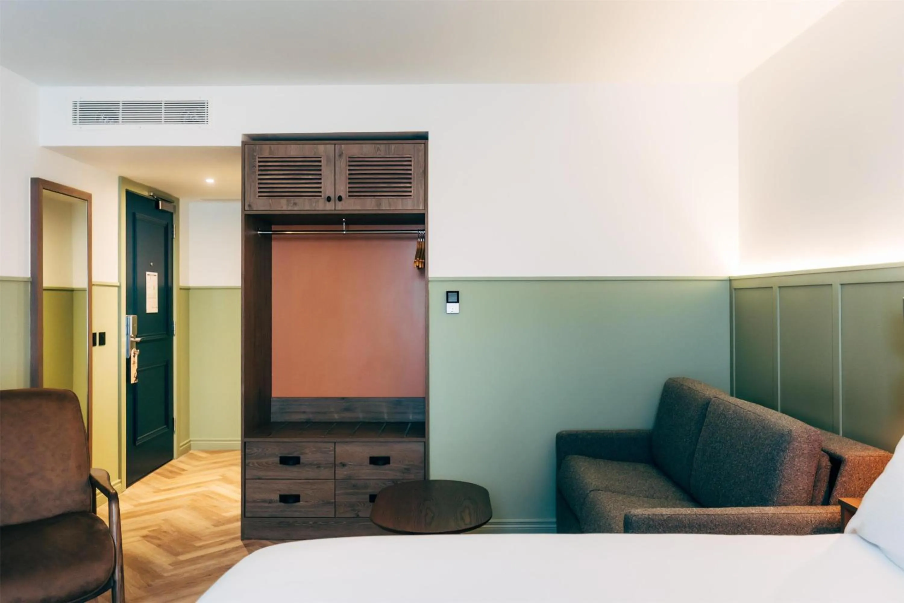 Living room, Bed in The Marcus Portrush, Tapestry Collection By Hilton