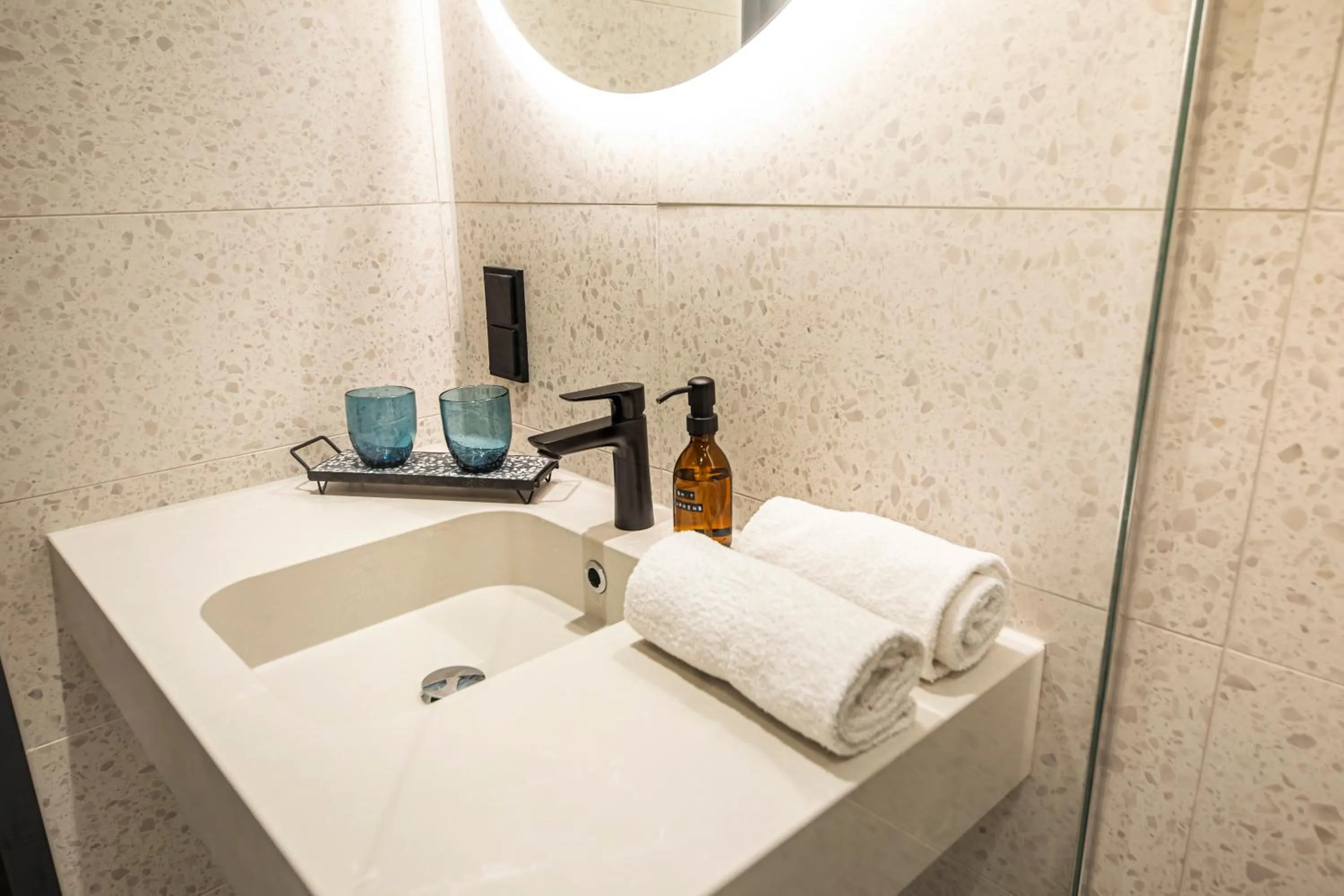 Bathroom in LOGINN Hotel Köln Airport