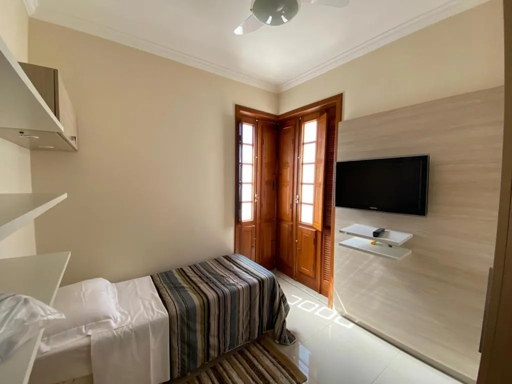 Bed in Pousada Maria Monteiro Tiradentes