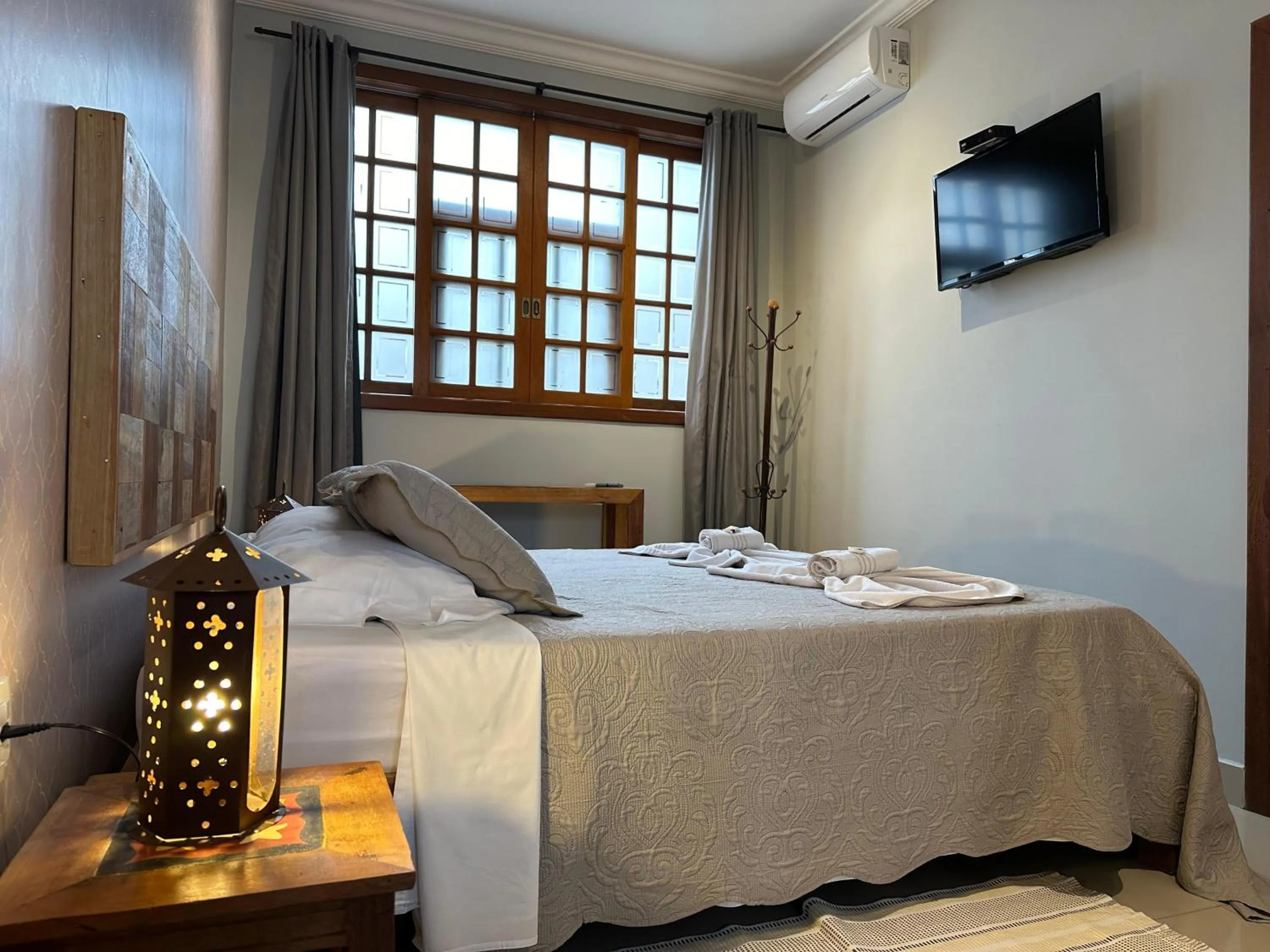 Bed in Pousada Maria Monteiro Tiradentes