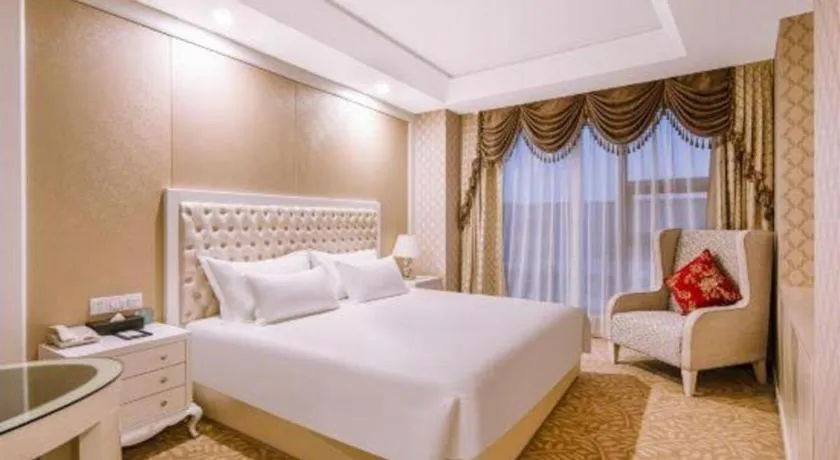 Bed in New Century Hotel Putuo Zhoushan