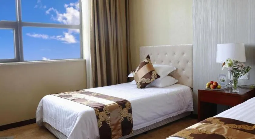 Bed in New Century Hotel Putuo Zhoushan