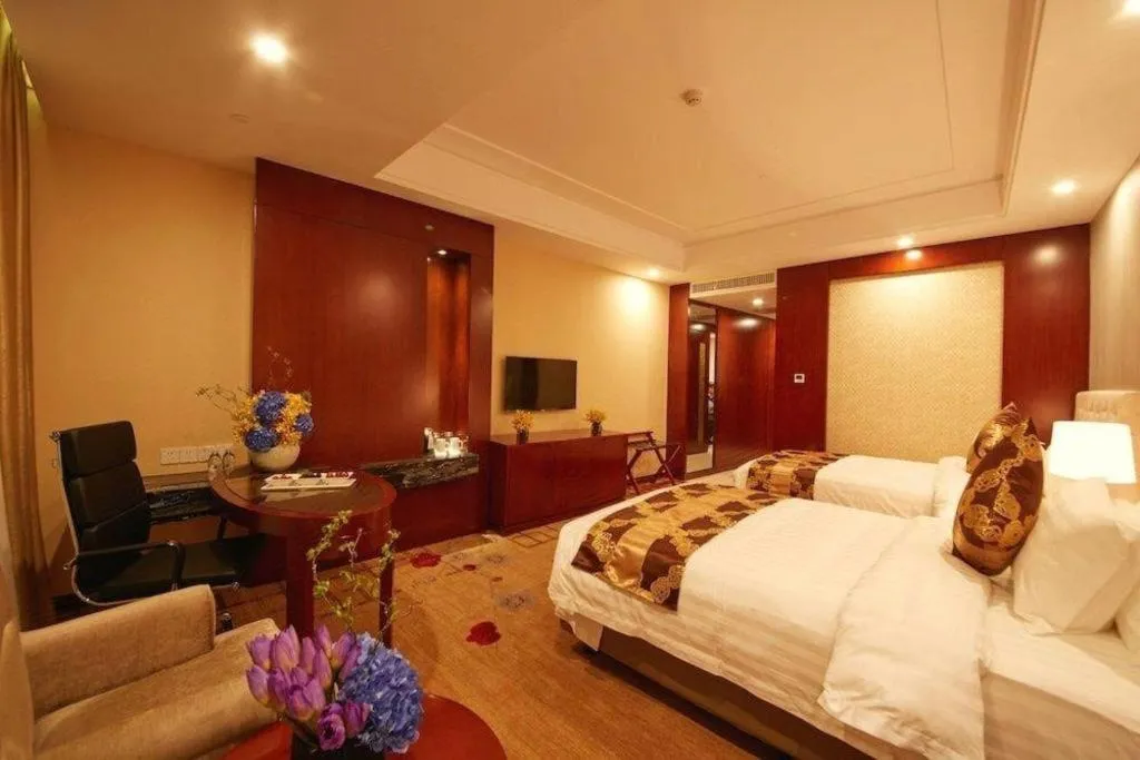 Bed in New Century Hotel Putuo Zhoushan