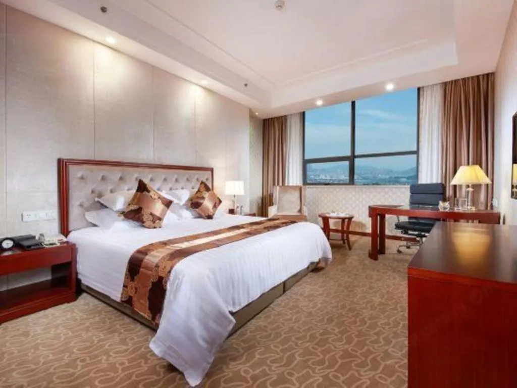 Bed in New Century Hotel Putuo Zhoushan