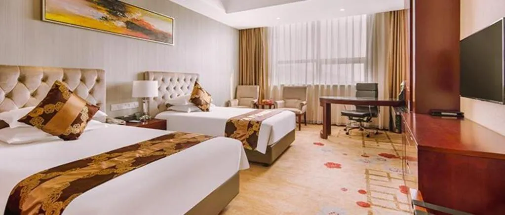 Bed in New Century Hotel Putuo Zhoushan