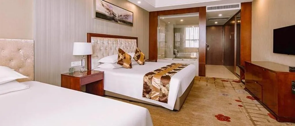 Bed in New Century Hotel Putuo Zhoushan