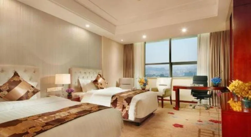 Bed in New Century Hotel Putuo Zhoushan
