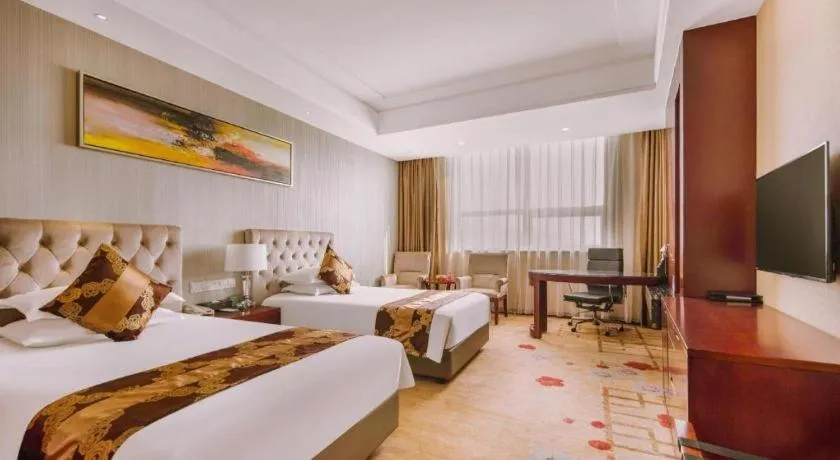 Bed in New Century Hotel Putuo Zhoushan