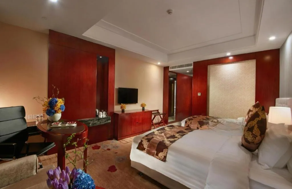 Bed in New Century Hotel Putuo Zhoushan