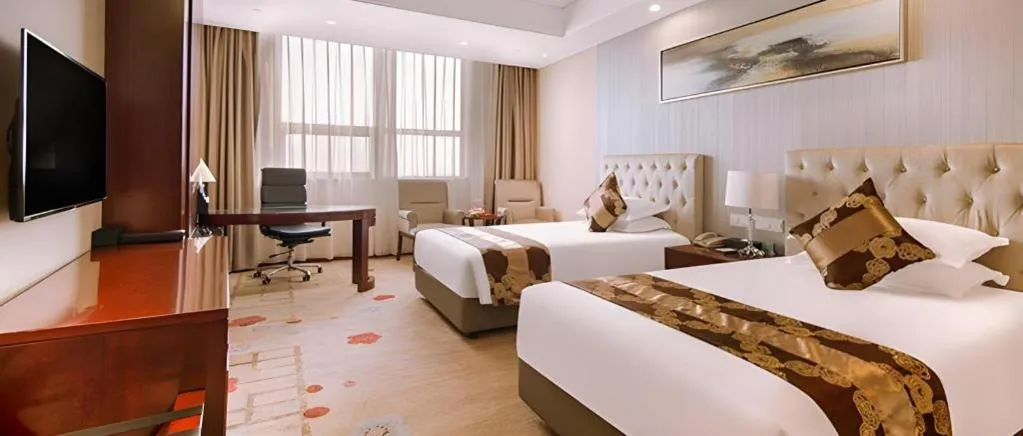 Bed in New Century Hotel Putuo Zhoushan